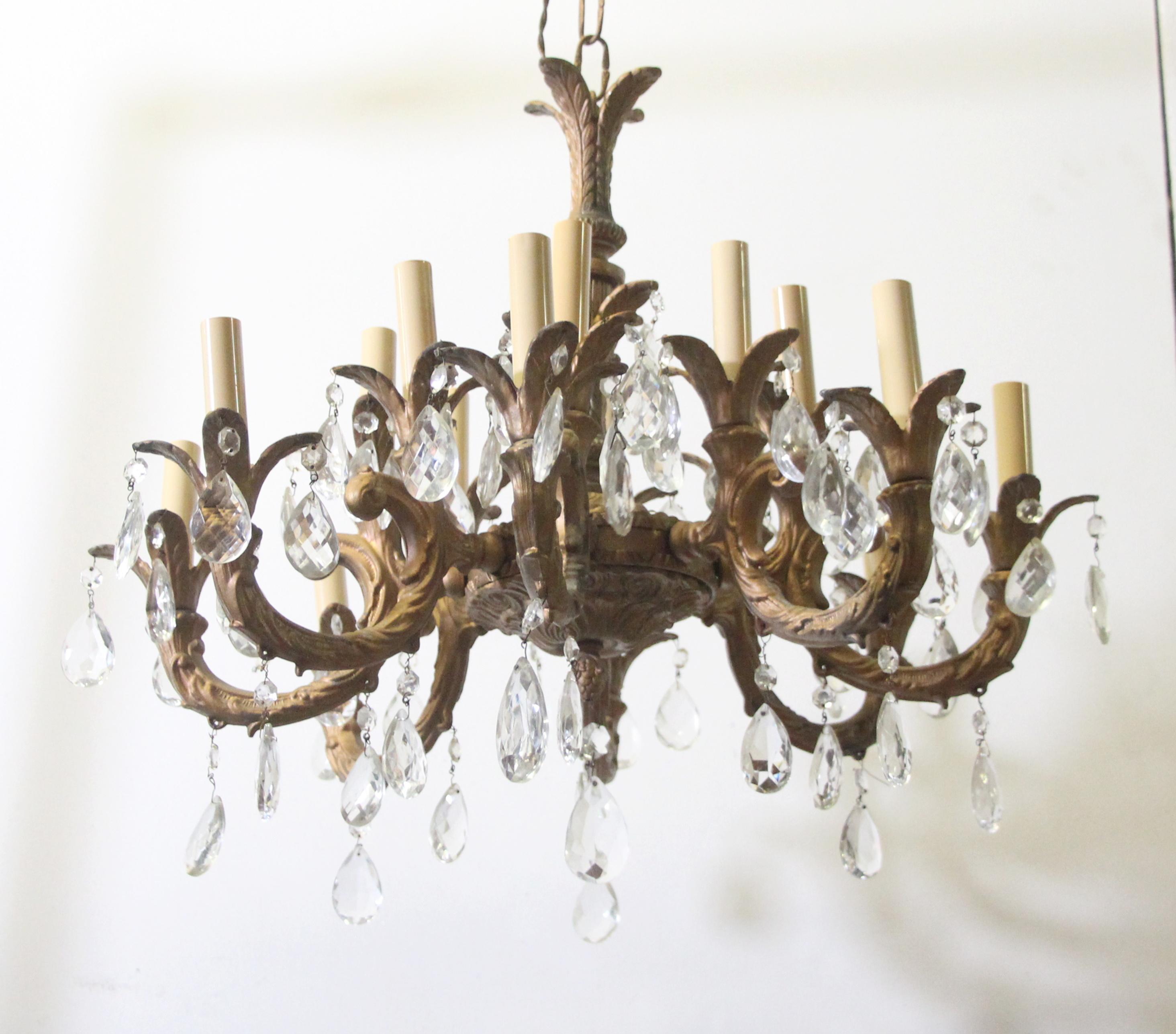 Cast brass Spanish chandelier with 8 detailed arms and clear crystals. Price includes restoration.