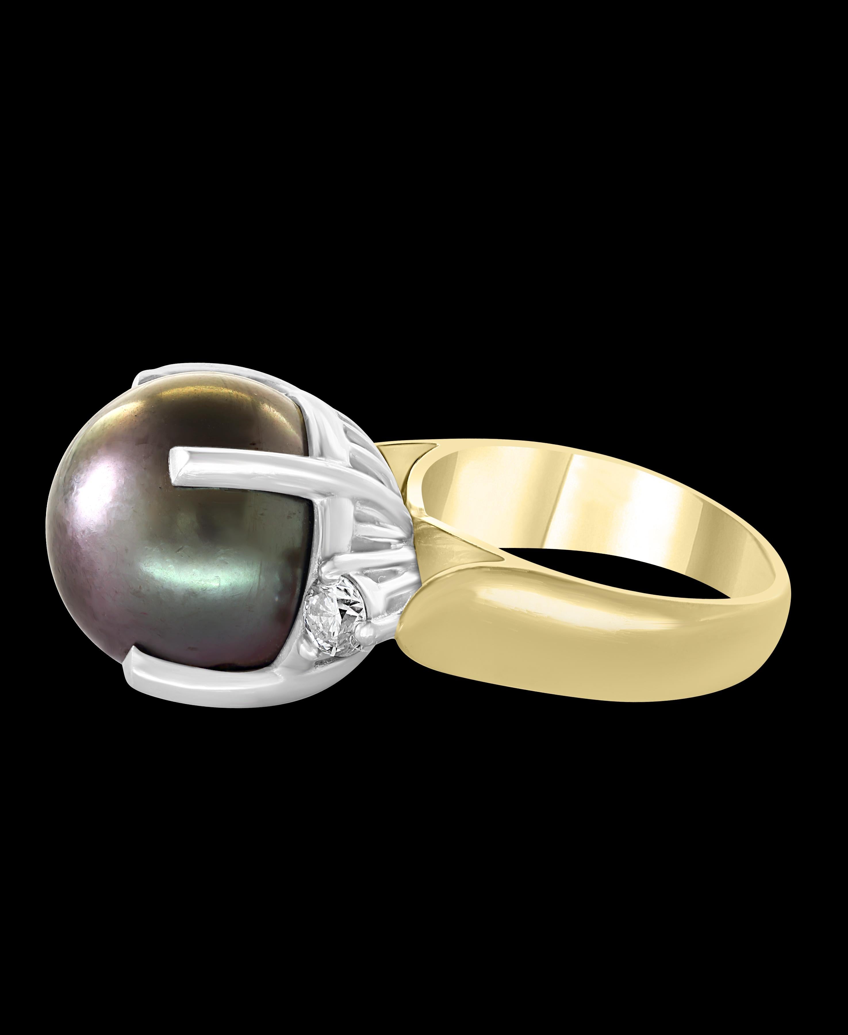 16 mm large Round Black Tahitian  Pearl  & Diamond Cocktail Ring  18 Karat White Gold and Platinum , stamped on the ring 
A classic, Cocktail ring 
Huge 16 mm Pearl very clean , in round shape , full of luster and shine  .
2 pieces of brilliant