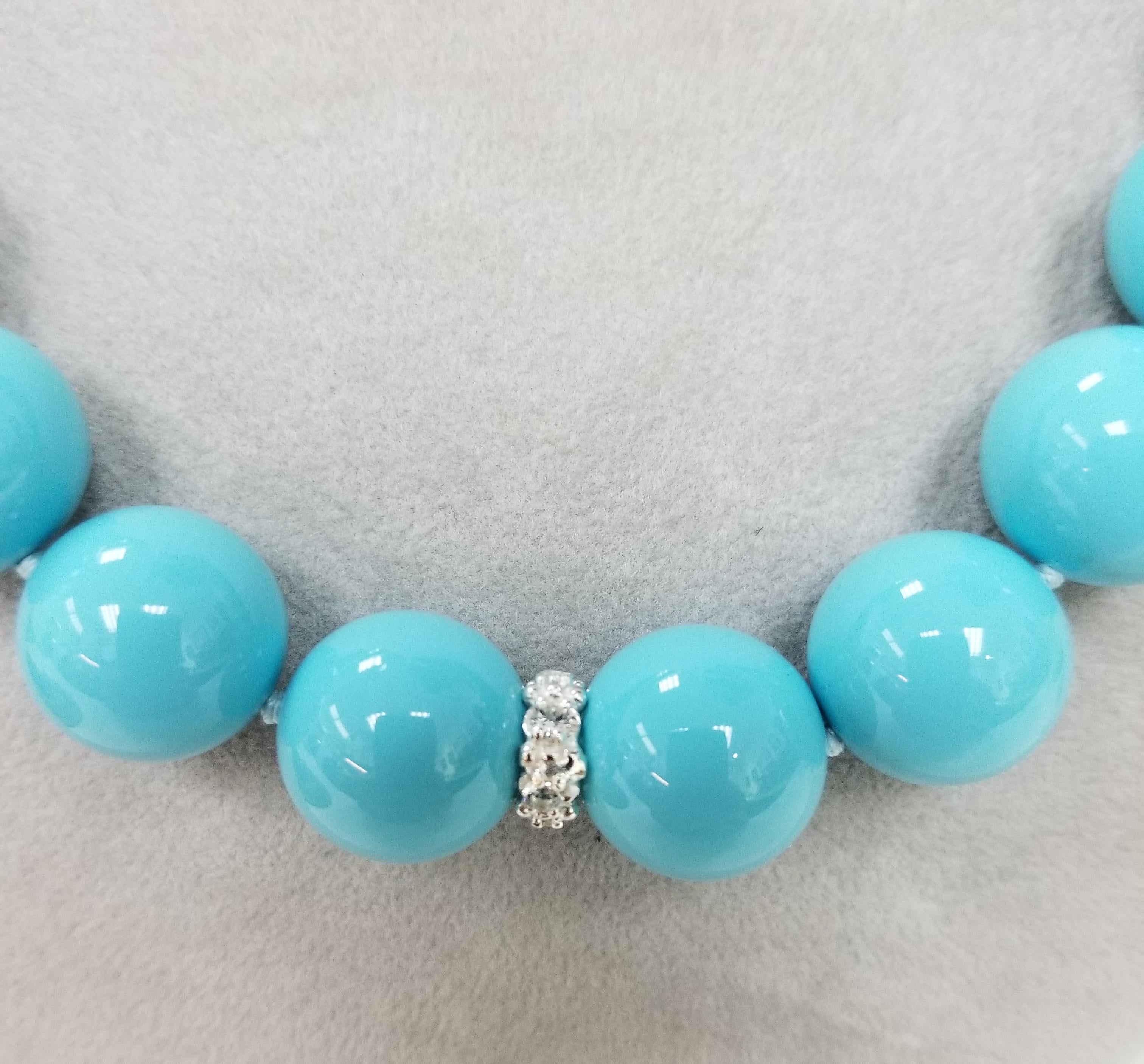 Classic style graces these 16 mm spherical beads of composite turquoise and sapphire rondelle necklace, containing 26 16mm composite turquoise beads enhanced by 5 rondelles with round white sapphires weighing 2.42cts. measures 18 inches with a large