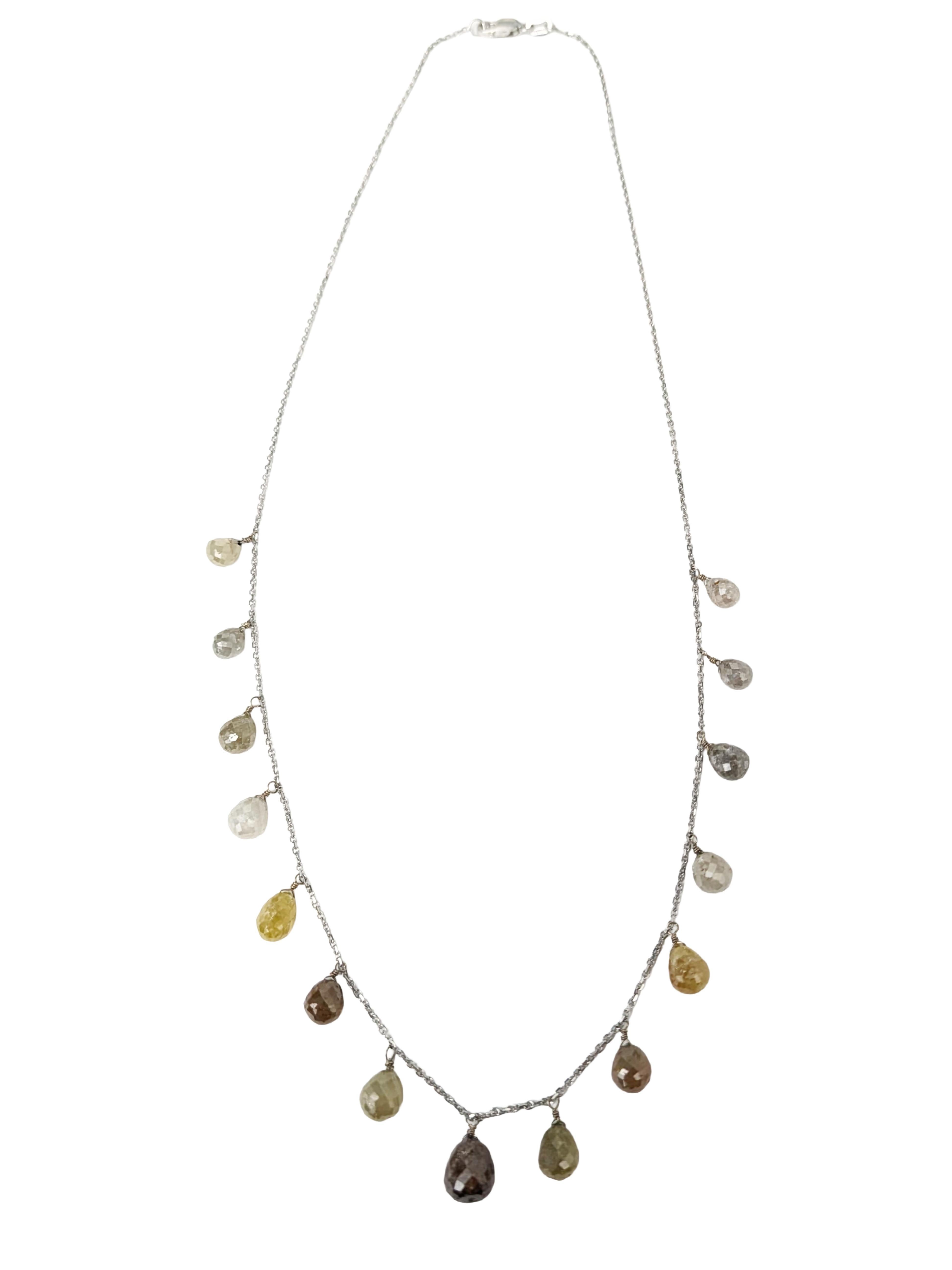 A luminous celebration of color and form. This 14K white gold necklace features a cascading arrangement of multicolored briolette diamonds in shades of grey, brown, orange, and soft yellow. Each faceted briolette is delicately set along the chain