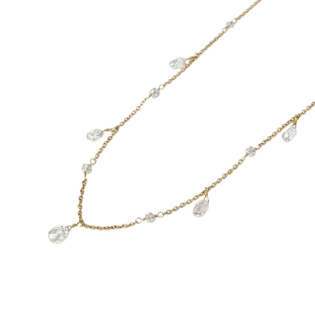 Cet élégant collier de 16 pouces présente une délicate chaîne câblée en or jaune 18 carats rehaussée de perles de diamants blancs facettés, chacune ajoutant une touche d'éclat raffiné. Les diamants sont régulièrement espacés et enveloppés à la main