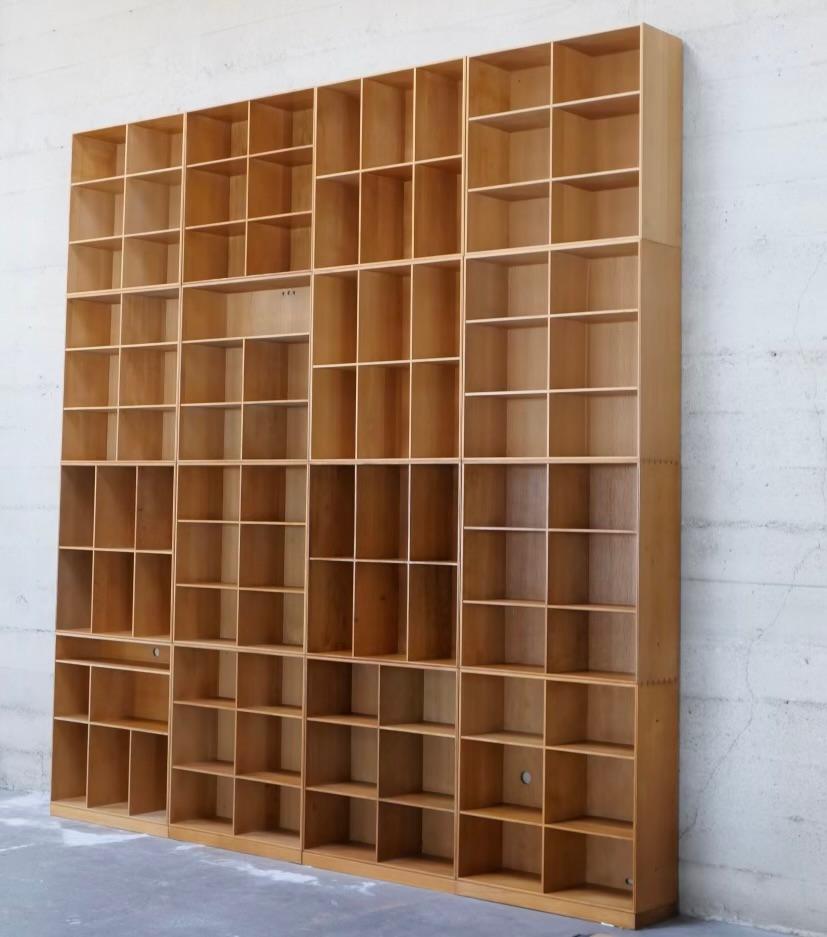 Modular bookcases designed by Professor Mogens Koch in Denmark 1929. Production began in 1932 and was exclusively made by master cabinetmaker Rud. Rasmussens until they closed in the mid 2000s. This collection was built over several years and