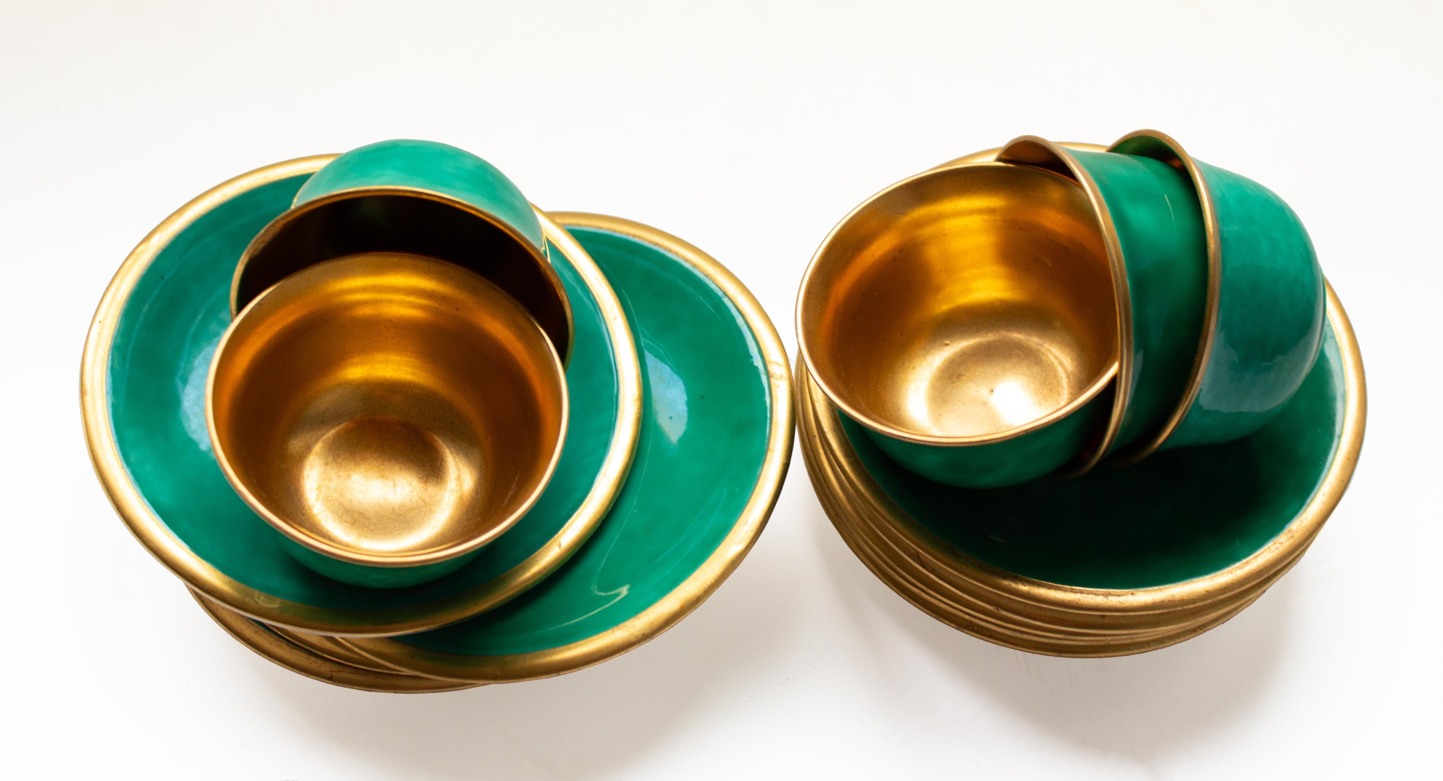 16 Scandinavian Modern Gilded Chocolate/Espresso Cups by Wilhelm Kåge, Gustavsberg, Made in Sweden. Green enamel with interior gilding.

The gilded details on the espresso cups give them a sophisticated and luxurious look and they never go out of