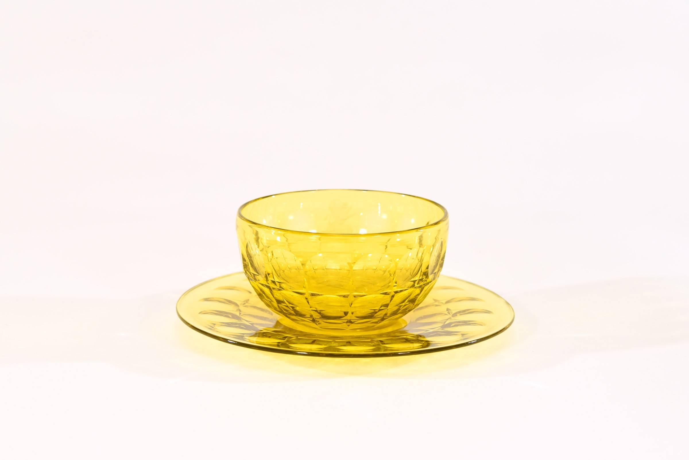 Not 12, but a set of 16 hand blown Bristol Yellow crystal bowls and underplates made by Steuben, Carder Period Ca. 1920's. Most likely a custom order with a rare pattern of large bowls 5