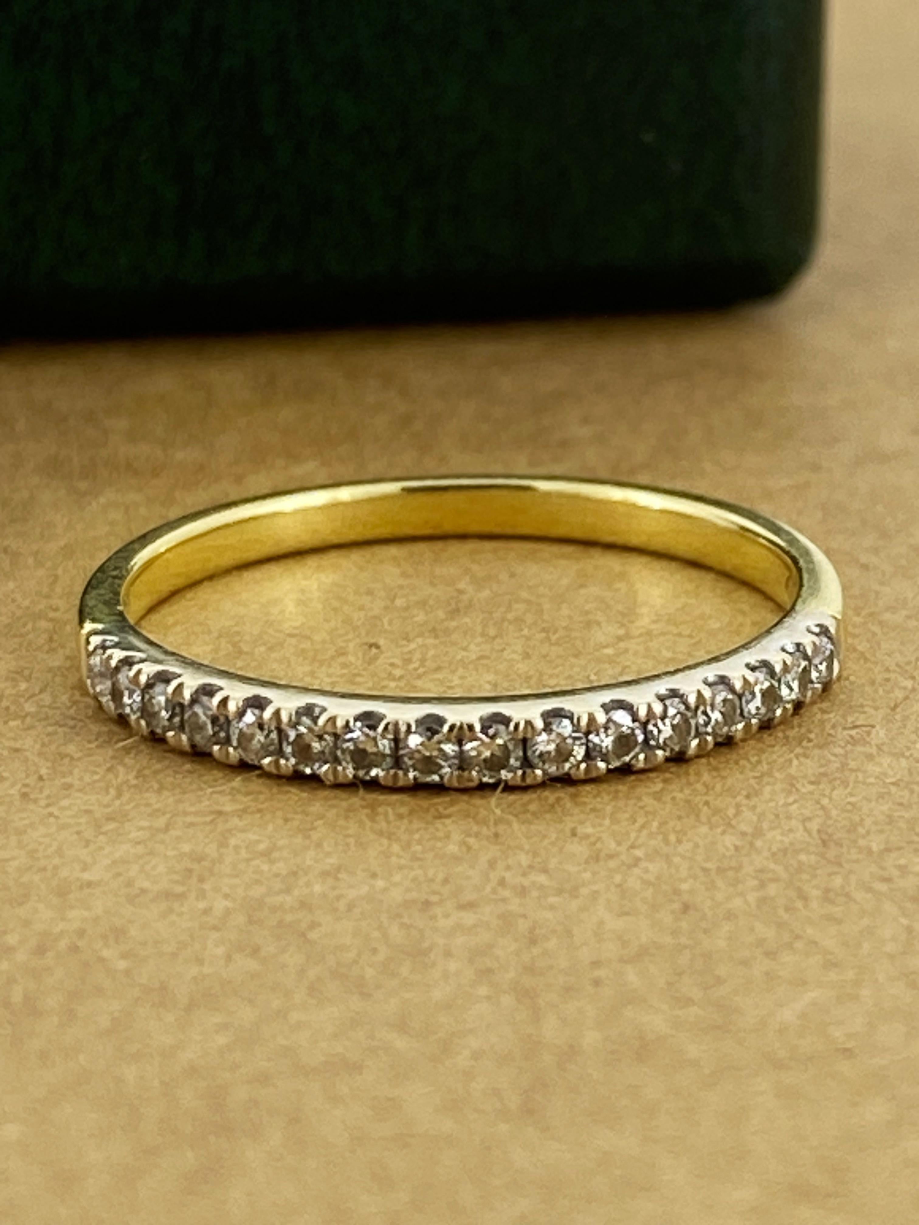 Securely castle-set in 9K White Gold 
16 Natural Round Brilliant Cut Diamonds 
exhibit sun-like brilliance, 
of G-H colour, VS-SI1 clarity, 
totalling 0.25ct approx. 

The band is crafted in 9K Yellow Gold, 
dainty & well-proportioned it measures 2