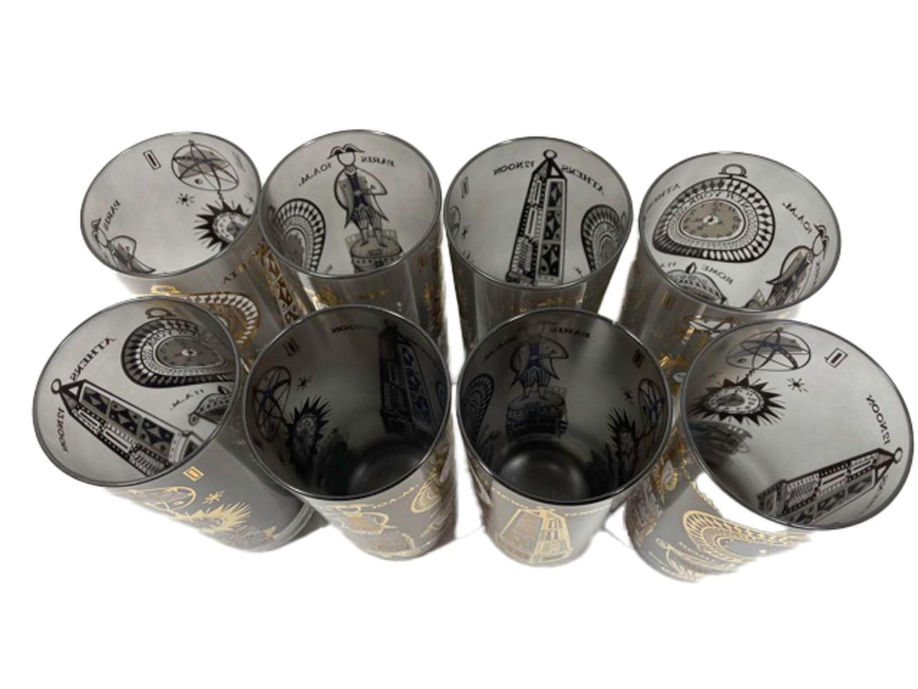 Set of 16 Mid-Century Modern Georges Briard glasses in the International Time Zone pattern. Costing of 8 highball and 8 double old fashioned glasses of clear glass with the interiors frosted a grey/black and decorated on the outside in 22k gold and