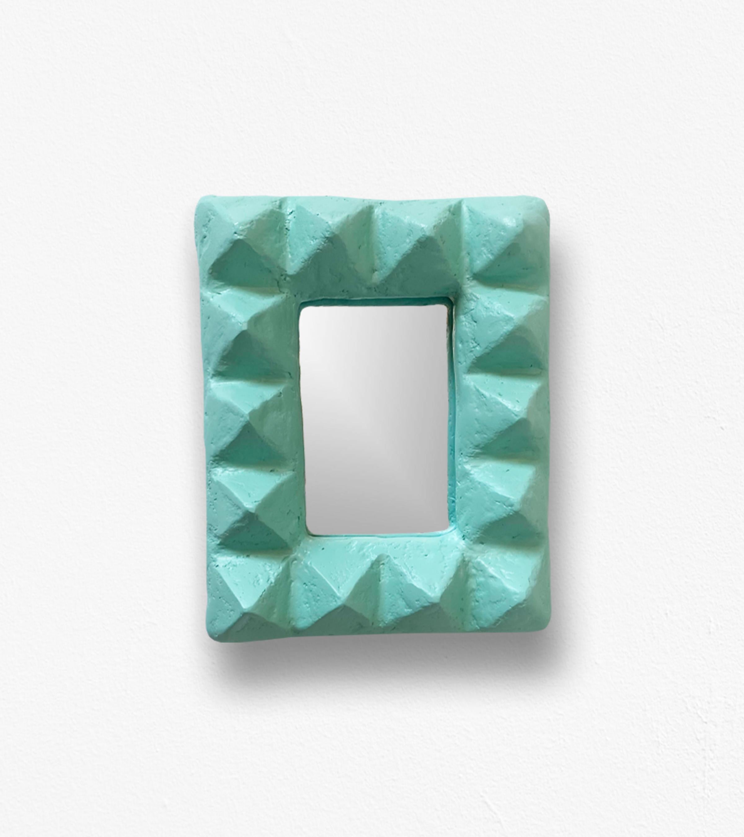 Introducing the Le Stud Mirror, a bold, architectural wall mirror that celebrates texture, form, and irreverent style. 

This sculptural piece redefines the traditional mirror with its robust, hand-carved frame and rhythmic geometry. Handcrafted