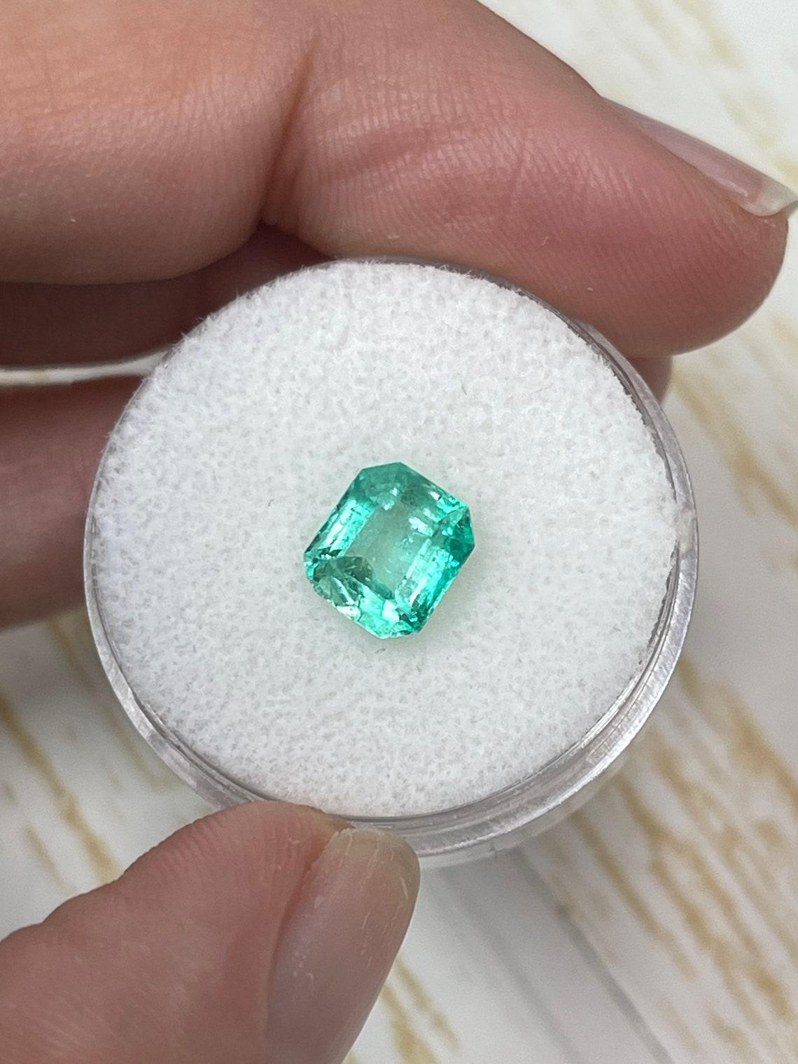 Modern 1.60 Carat 7.5x6.5 Light Green Colombian Emerald - Eye Clean Genuine Emerald Cut For Sale