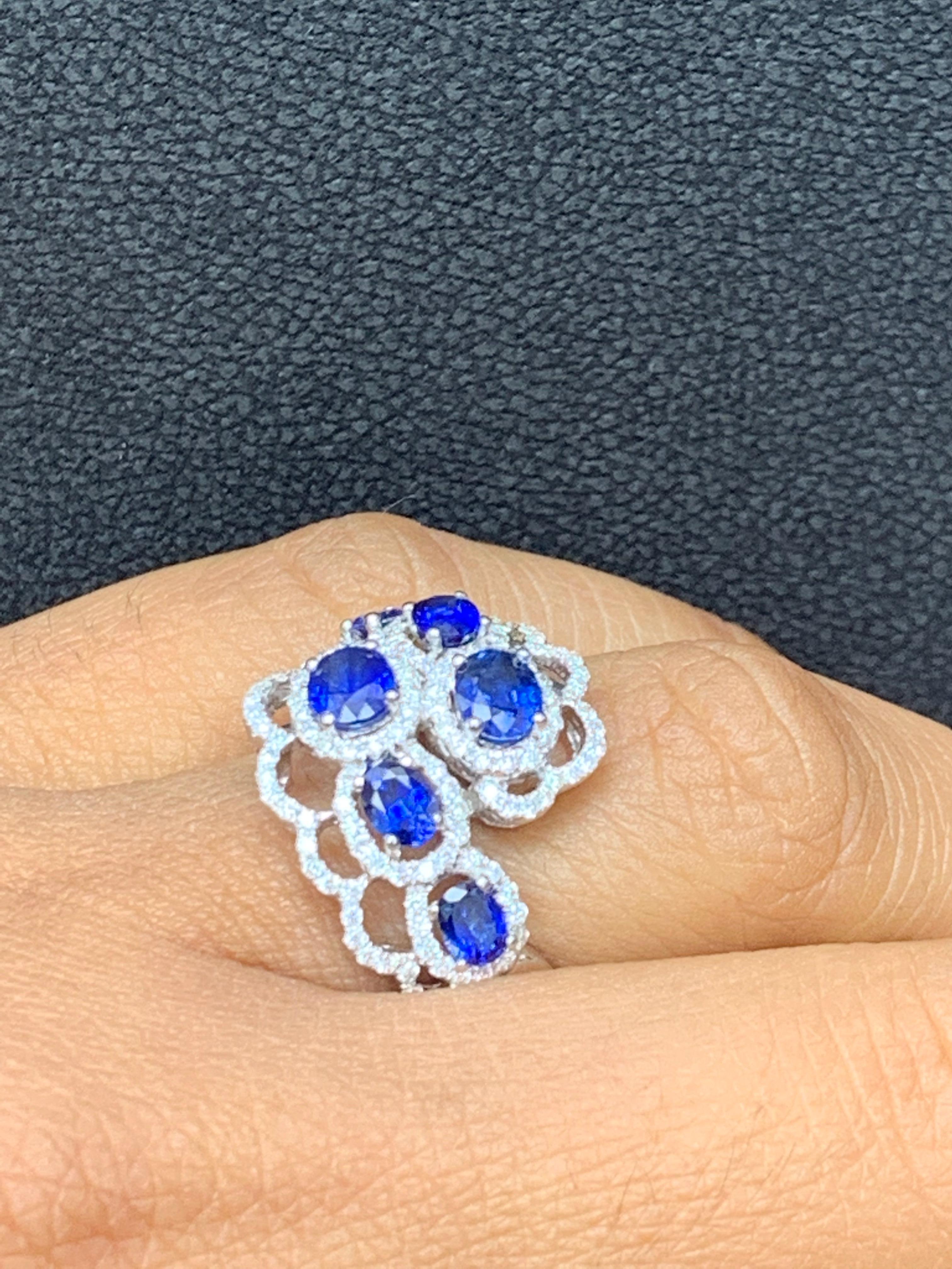 Modern 1.60 Carat Blue Sapphire Diamond Open Work Halo Fashion Ring in 18K White Gold For Sale