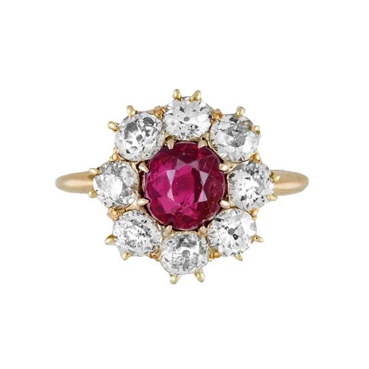 Simply Beautiful! Finely detailed GIA NO HEAT Burma Ruby and Diamond Vintage Antique Gold Ring. Centering a securely nestled Hand set Round NO HEAT Burma Ruby weighing approx. 1.60 Carat. GIA lab report # 6224958874. Surrounded by Diamonds, approx.