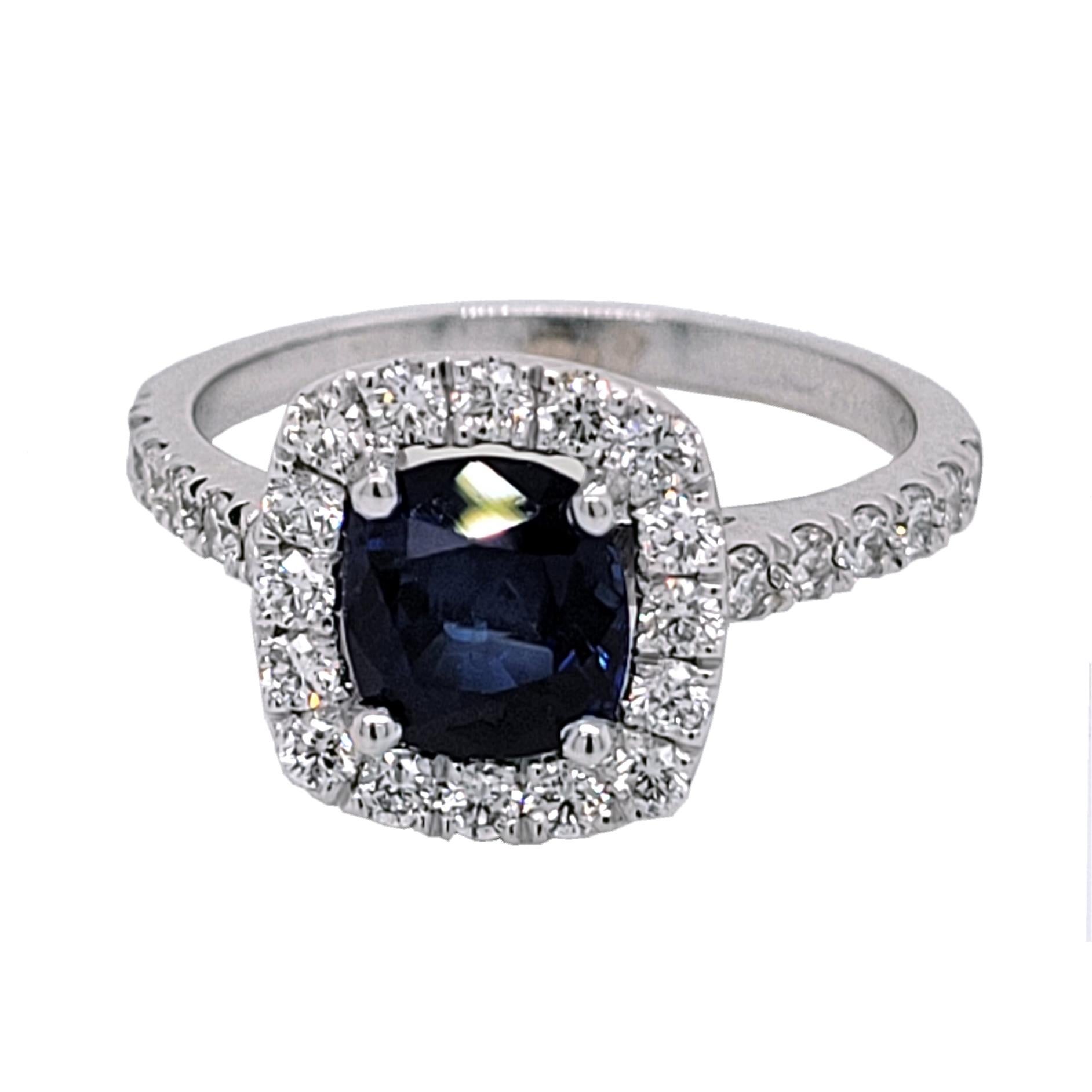 A  Beautiful Color 1.60 Ct Cushion Shaped Sapphire set in a gorgeous 18k gold  Pave set engagement Ring with halo. Total diamond weight of 0.59 Ct. diamonds on the side. 

Center stone: 1.60 Ct Cushion Shape Sapphire
Side stones: 0.59 total carat