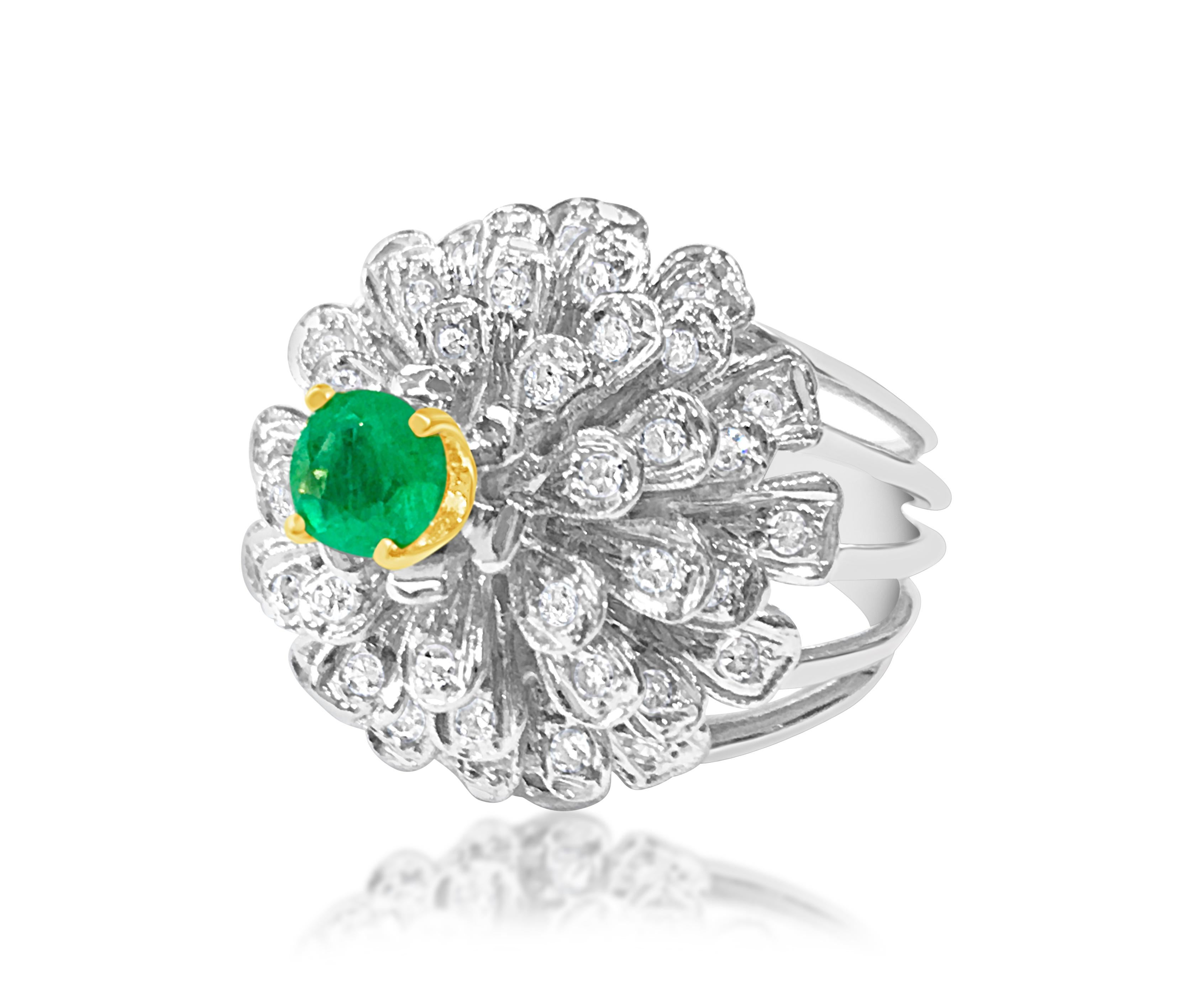 Metal: 14K White Gold. 
Center: 0.60 carat emerald, 100% natural earth mined. Colombian emerald. 

Diamonds: 1.30 carat side diamonds. VVS clarity and F color. All diamonds are 100% natural earth mined. 

Wonderful flower and blooming design.

Ring