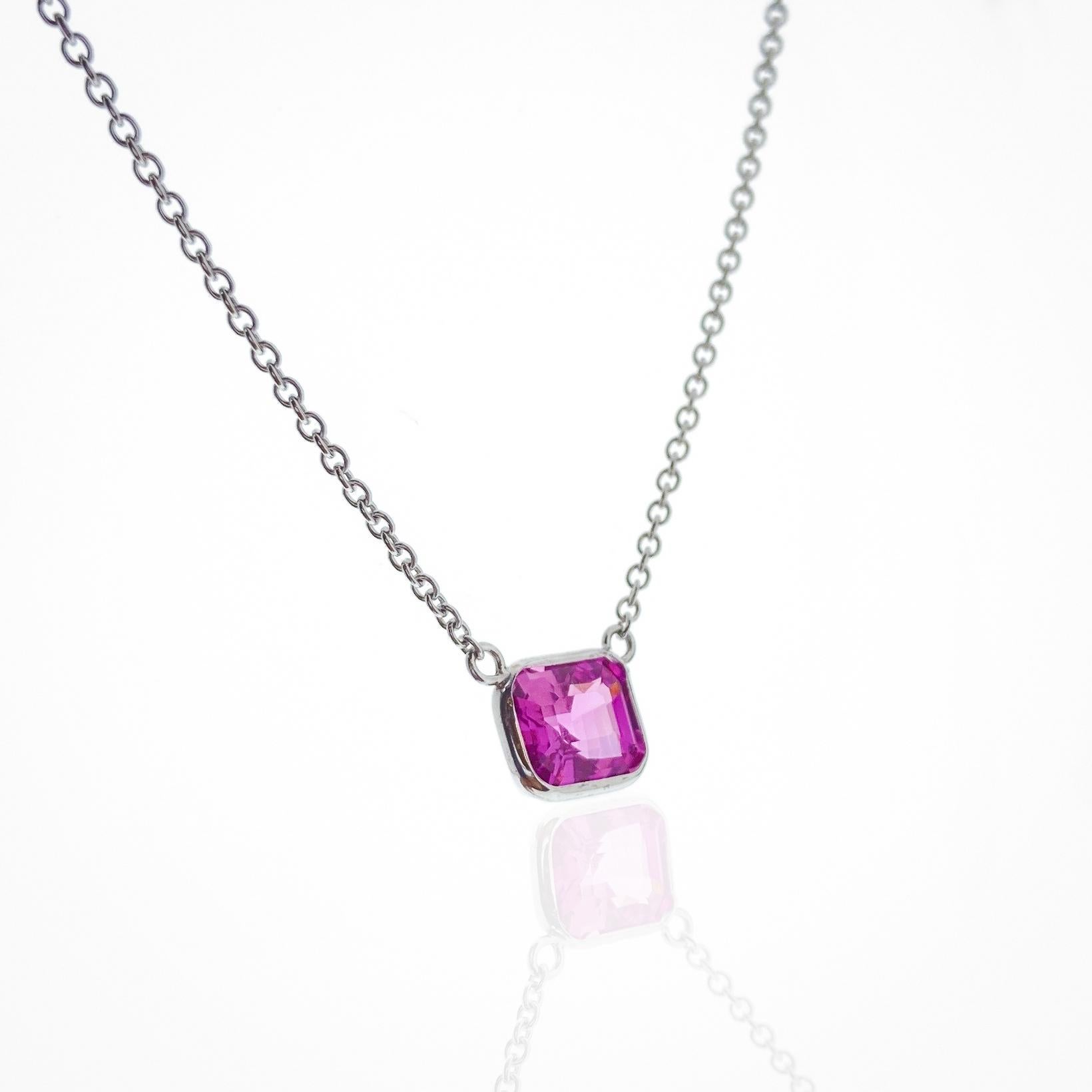 This necklace features an emerald-cut pink sapphire with a weight of 1.60 carats, set in 14k white gold (WG). Pink sapphires are a rare and beautiful choice for jewelry, and an emerald cut can accentuate the gem's natural beauty. Sapphire necklaces