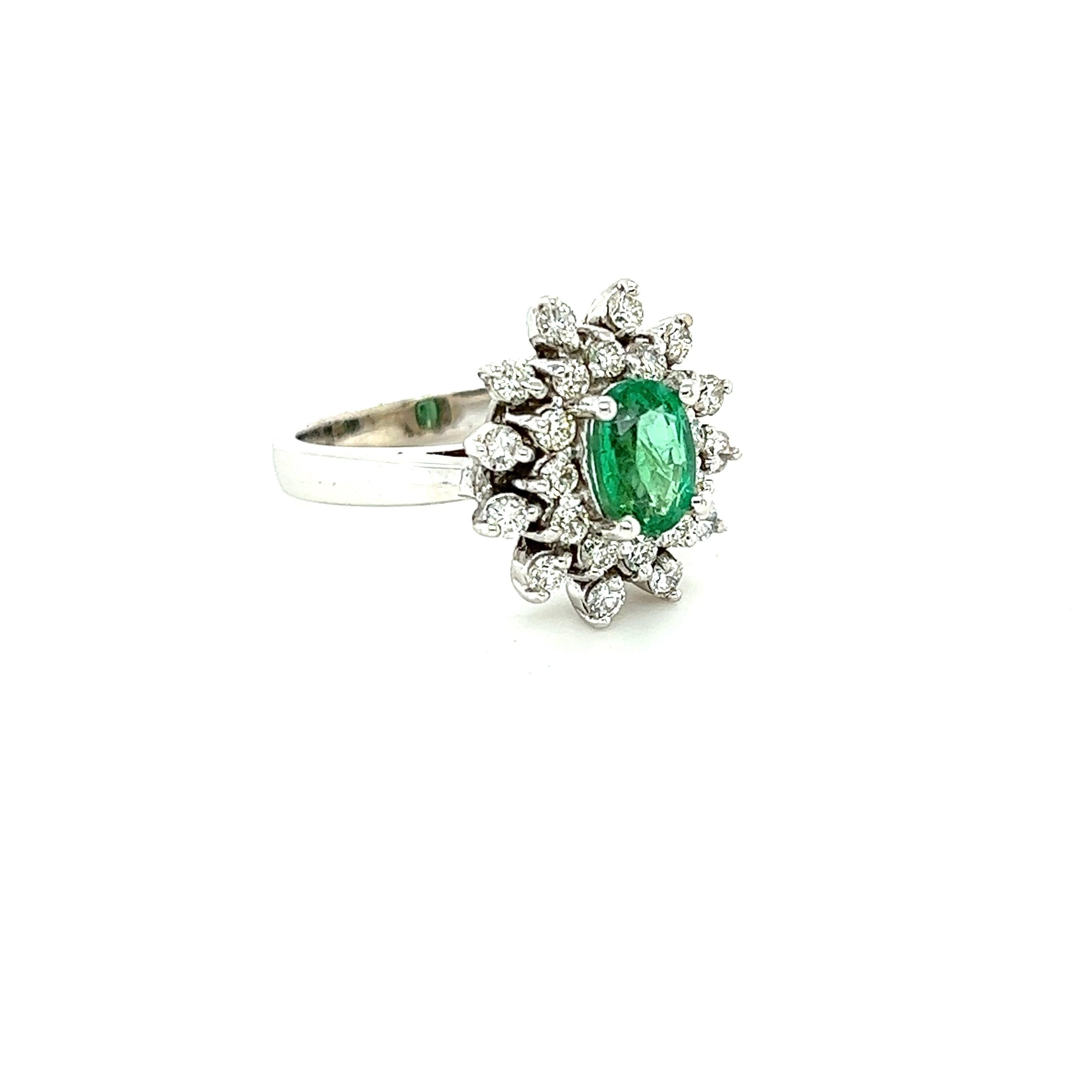 This ring has a 0.94 Carat Oval Cut Emerald and is surrounded by 24 Round Cut Diamonds that weigh 0.66 Carats. (Clarity: SI, Color: F) The total carat weight of the ring is 1.60 carats. 
The Oval Cut Emerald measures at approximately 7 mm x 5 mm.