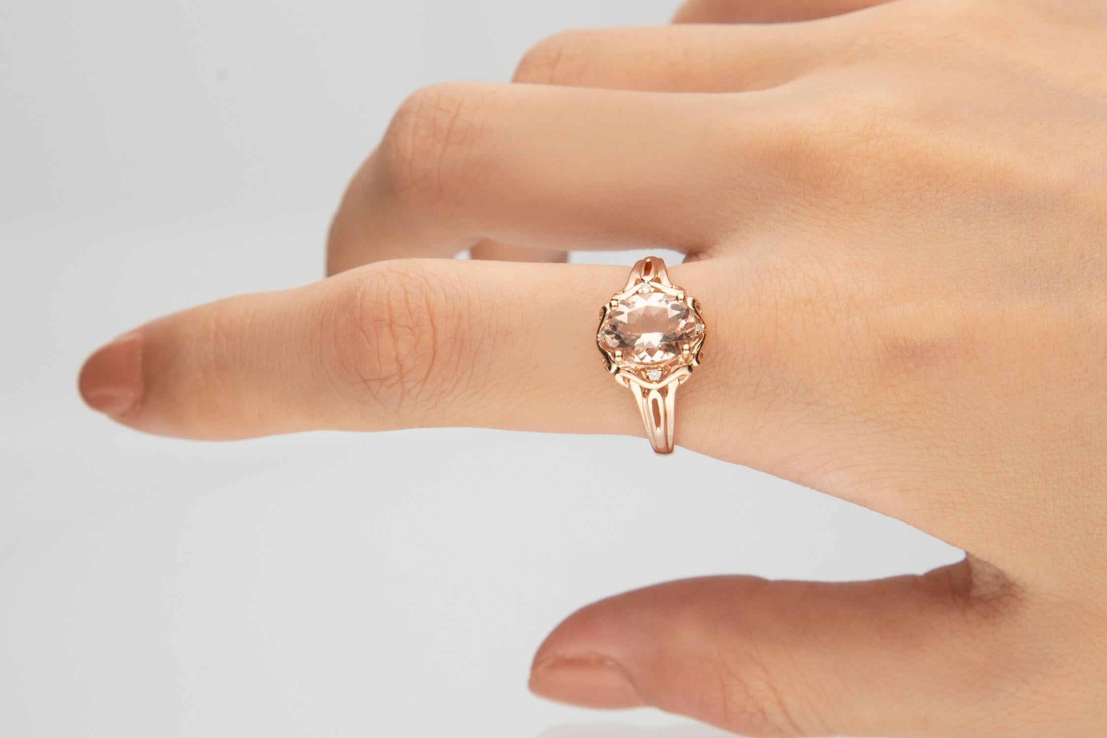 A large oval-cut Genuine morganite gemstone is set at the center of this lovely Gin & Grace ring, accentuated by four glittering diamond accents. This jewelry is crafted of 10-karat rose gold with a sleek polish. Gemstone colors: Pink Gemstone