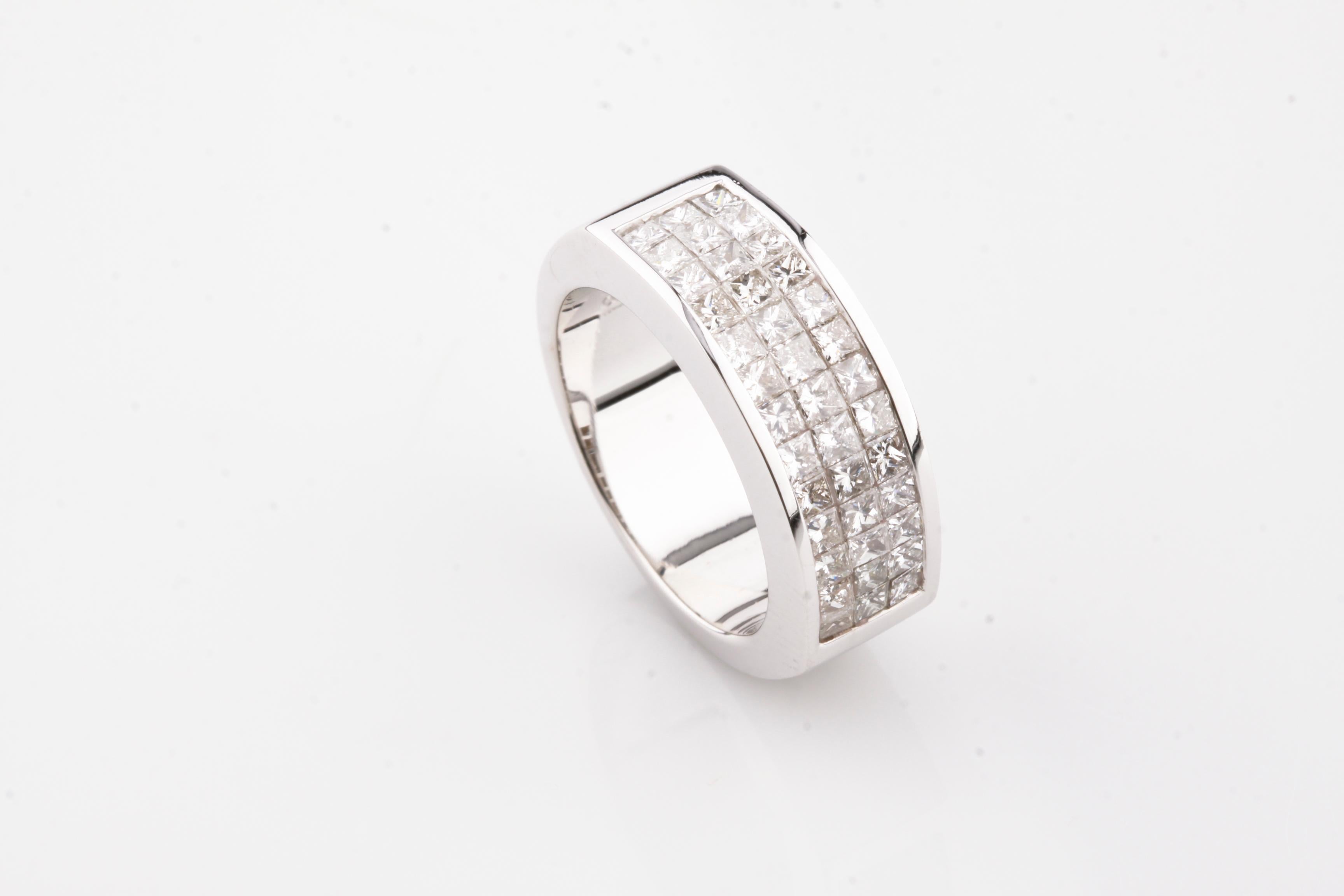 Features Princess Cut Invisible Set Diamond Plaque
Total Diamond Weight = 1.60 ct
Average Color = G - H
Average Clarity = VS - SI
Size 6
Total Mass = 12.05 grams
Width of Front = 8 mm
Width of Band at Reverse = 7 mm
Gorgeous Ring!