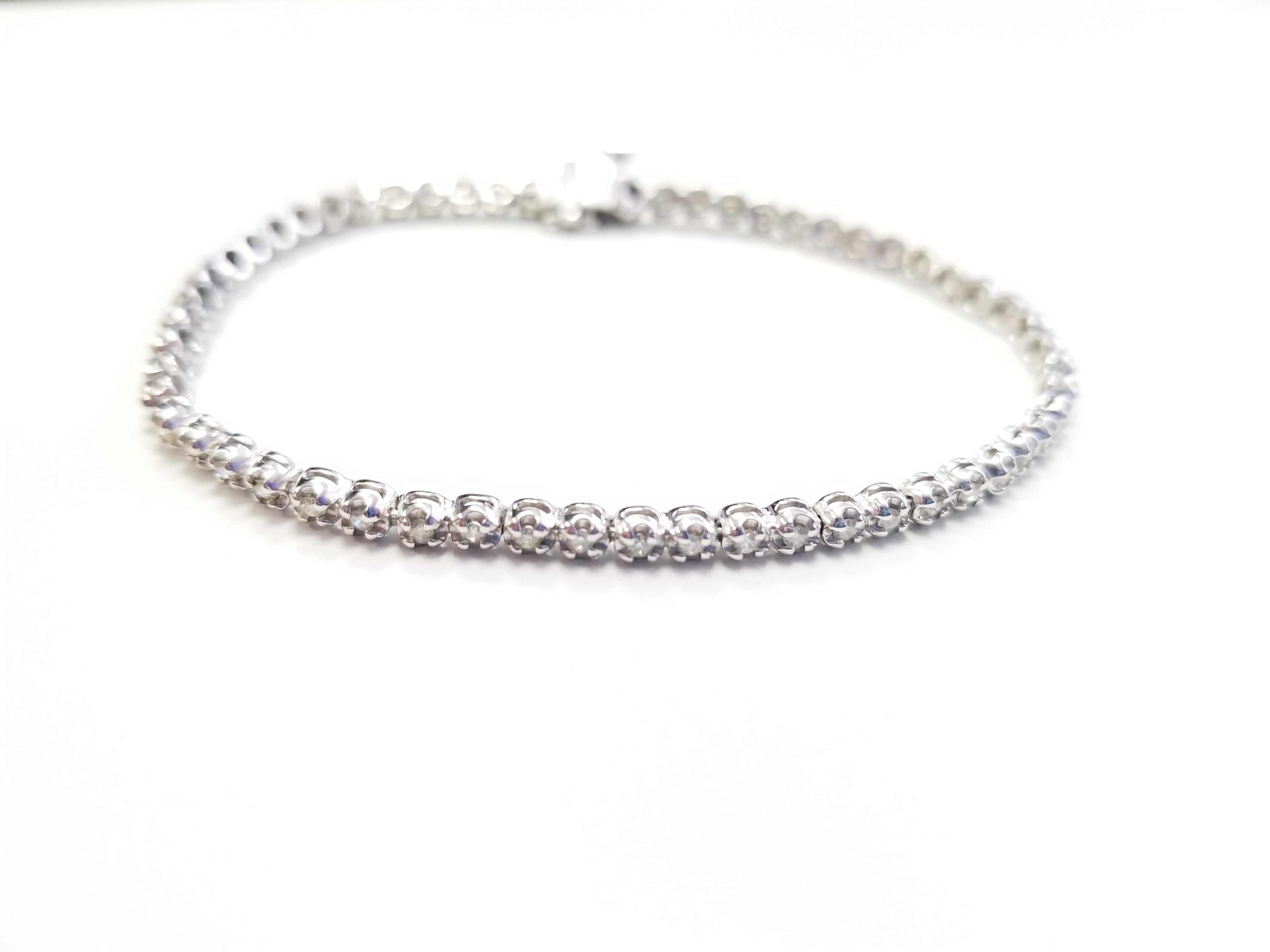 Very sparkling and shiny. a great quality tennis bracelet. 14k white gold. each stone is set in a classic four-prong style for maximum light brilliance. 7 inch length. Color I-J, Clarity SI3-I1