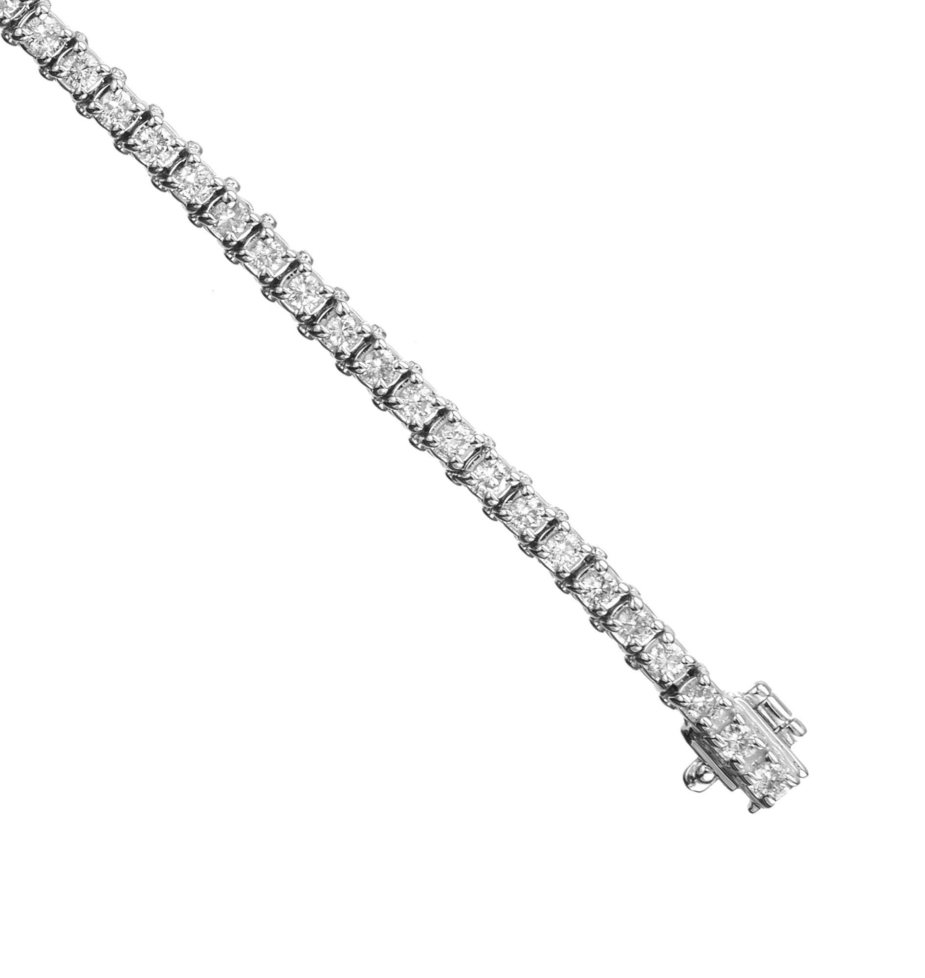 Classic diamond tennis bracelet. Adorned with 62 round brilliant cut diamonds totaling 1.60ct. that are set in 14k white gold. The diamonds radiate with brilliance and sparkle, catching the light with every movement. This bracelet is a perfect