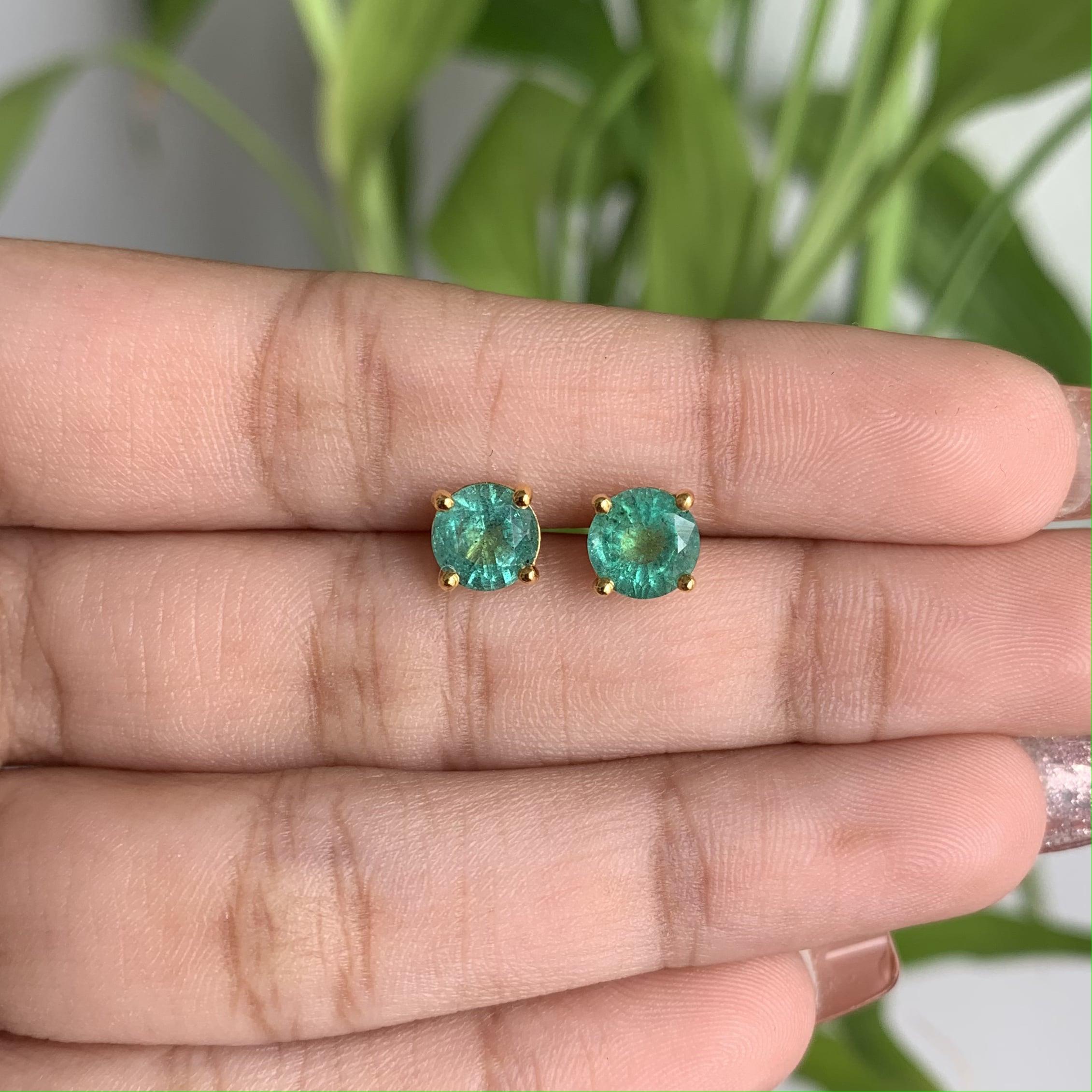 In search of a timeless set of everyday Emerald stud earrings? Your quest ends here with these exquisite Emerald studs!

With a combined weight of 1.60 Carats, these round-shaped emeralds boast a captivating and vibrant green hue that's bound to