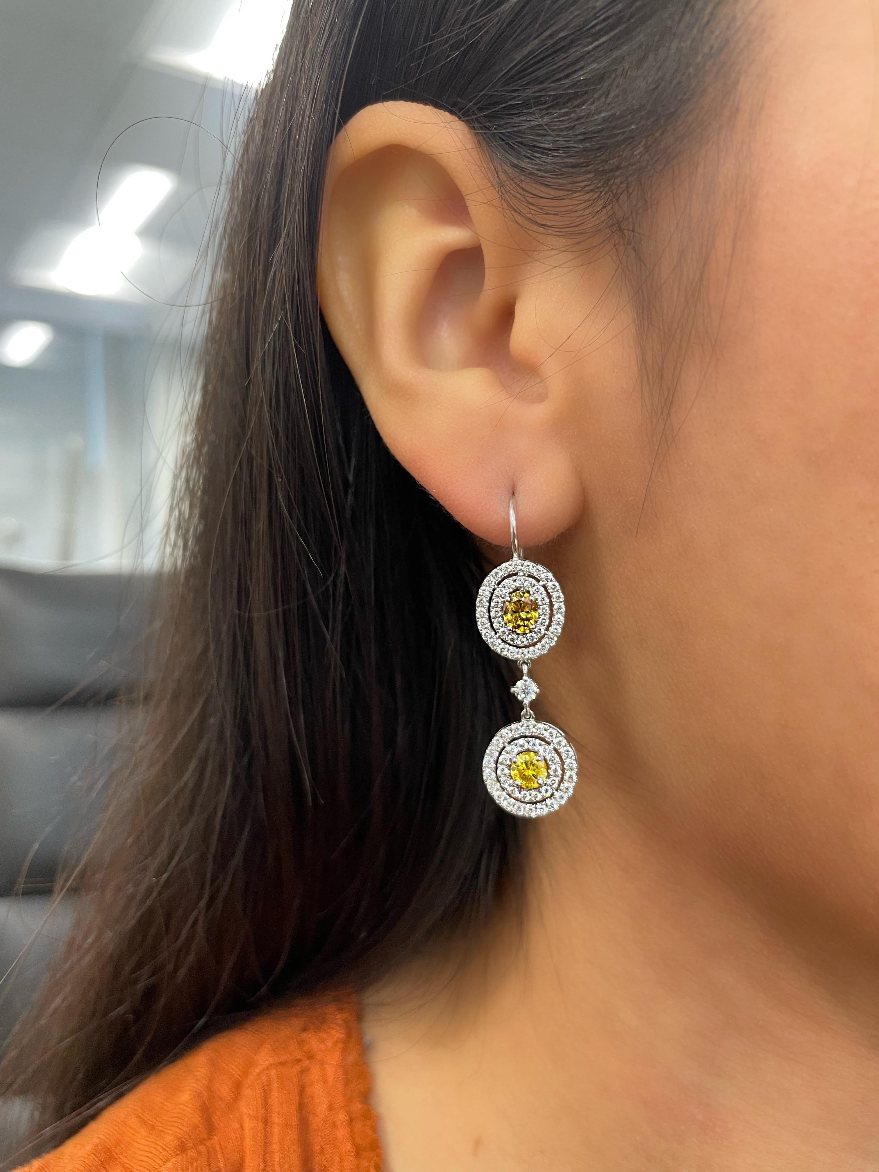 Oval Cut 3.38 ct GIA Certified Orange-Yellow Diamond Earrings For Sale