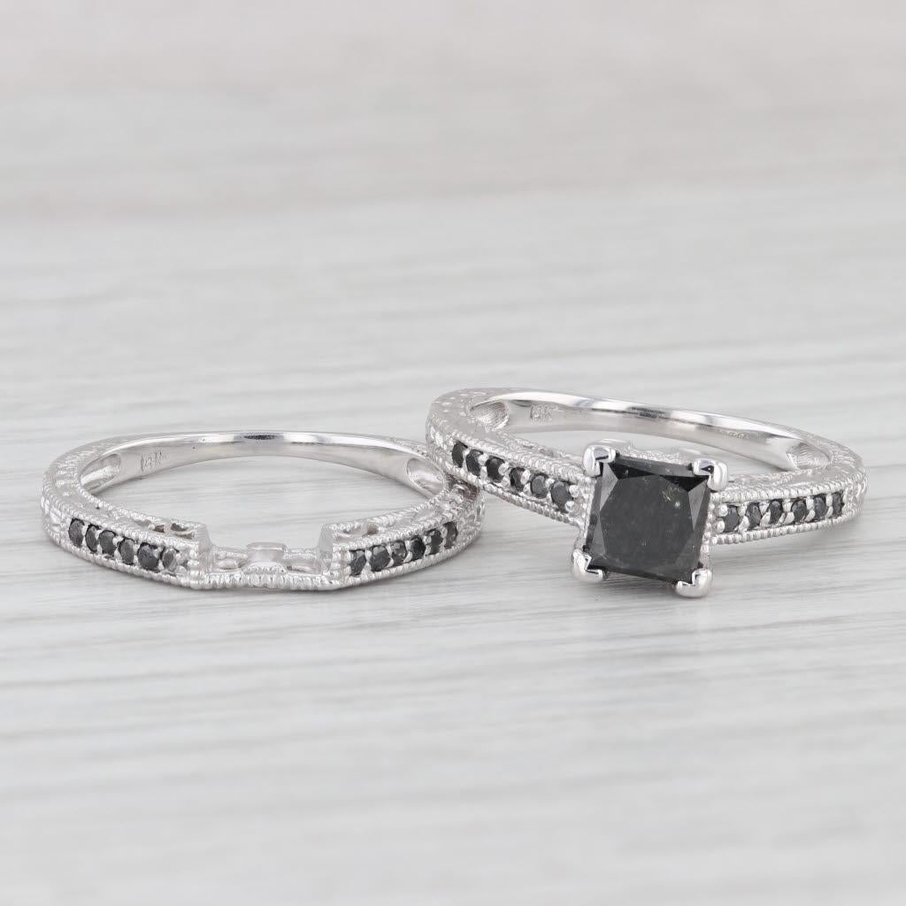 Gemstone Information: 
Engagement -
- Natural Diamond Center - 
Carats - 1.45 ct
Cut - Princess 
Color - Black
Treatment - Color Treated

- Natural Diamond Accents- 
Total Carats - 0.08 ctw
Cut - Round
Color - Black
Treatment - Color Treated

-
