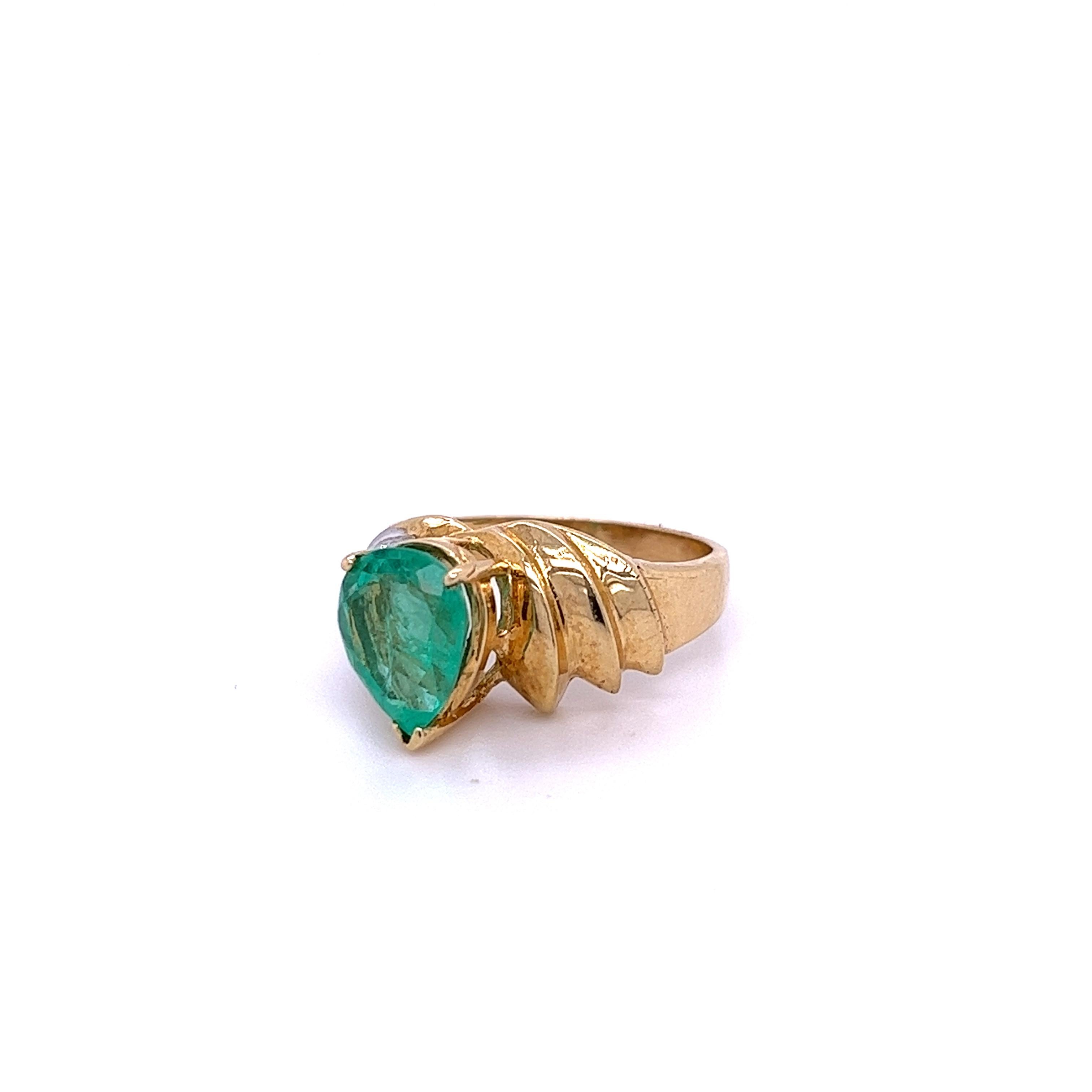 1.60-carat pear cut natural Colombian Emerald mounted in a secure 14k solid gold ring setting with 0.20 carats in round diamond accents. 14k solid gold ring and secure prong setting make for a secure fit that's ideal for daily wear. Hypoallergenic,