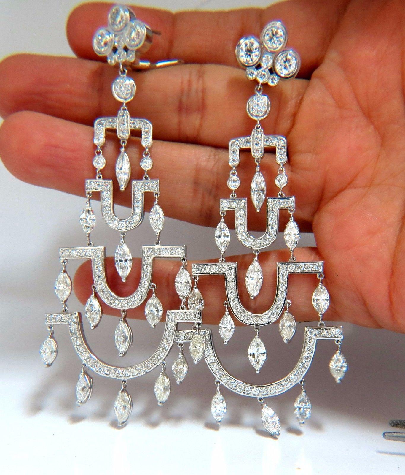 The Art Deco Edge.

The classic long chandelier earrings.

16.00cts of natural round diamonds: 

G/H-color, Vs-2 & si-1 clarity.

14kt. white gold

34.7 grams.

Earrings measure: 3.80 Inch Length

Lower Tier: 1.54 inch

upper tier: .60