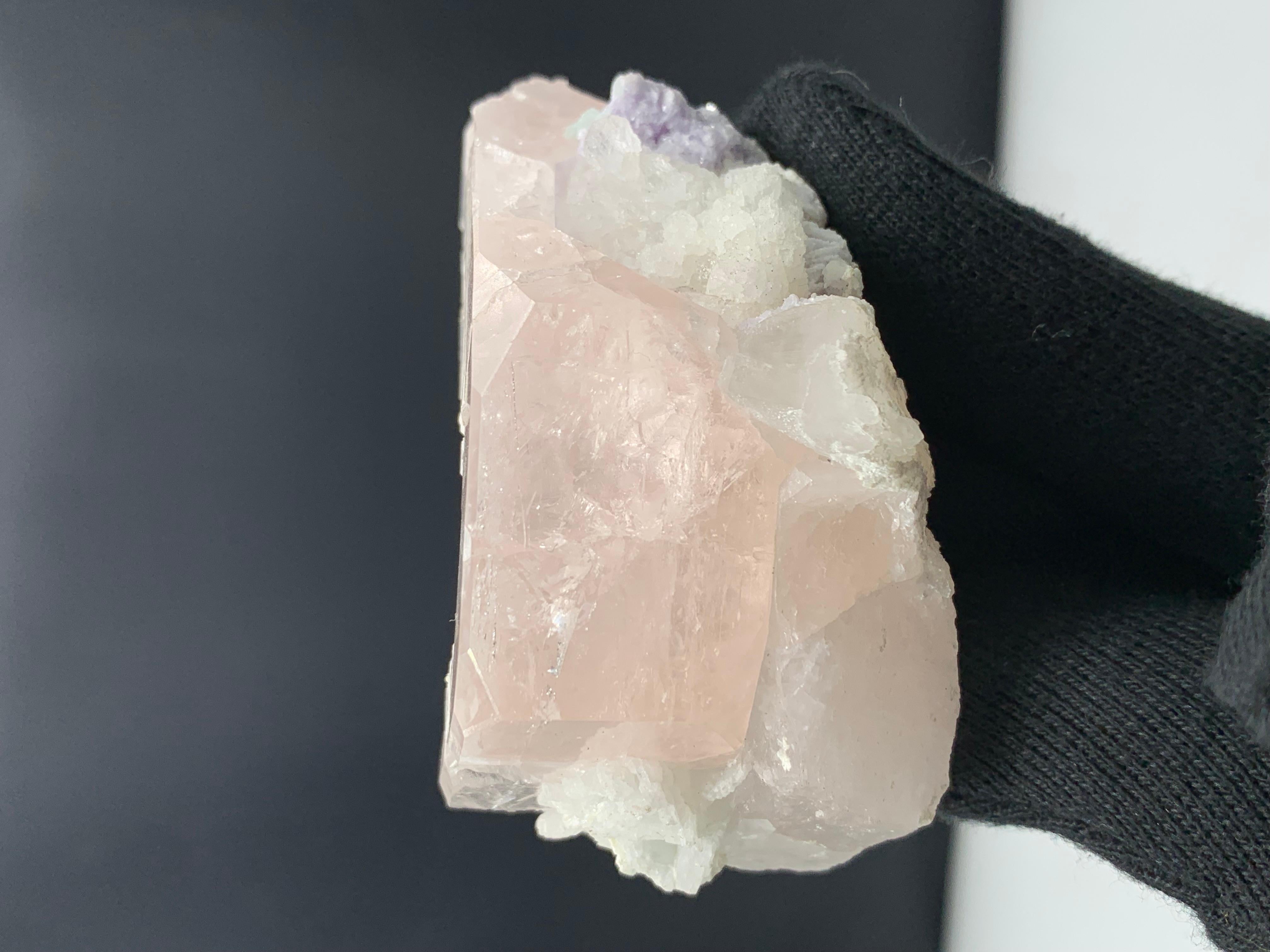 160.04 Gram Gorgeous Morganite Specimen Attached With Albite And Fluorite 

Weight: 160.04 Gram
Dimension: 3.9 x 7.4 x 4.3 Cm
Origin: Kunar, Afghanistan 

With its soft pinkish hue, morganite is often associated with innocence, sweetness, romance