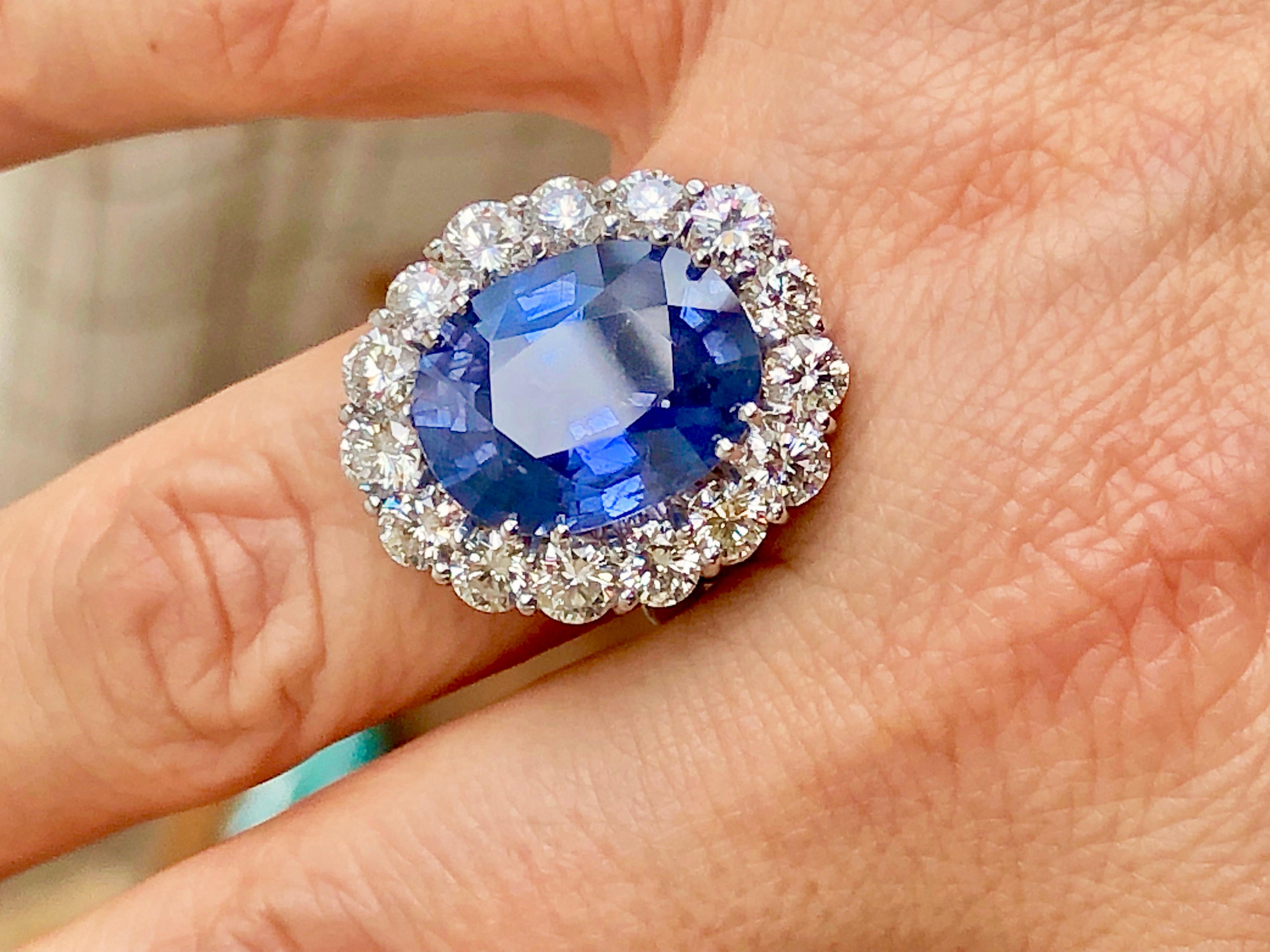 Magnificent, very large no heat, untreated oval cut blue sapphire 12.73 carat GIA Certified. 18K White Gold engagement ring. The ring was designed and made to bring out and showcase the natural beauty of the center stone. Fifteen white brilliant