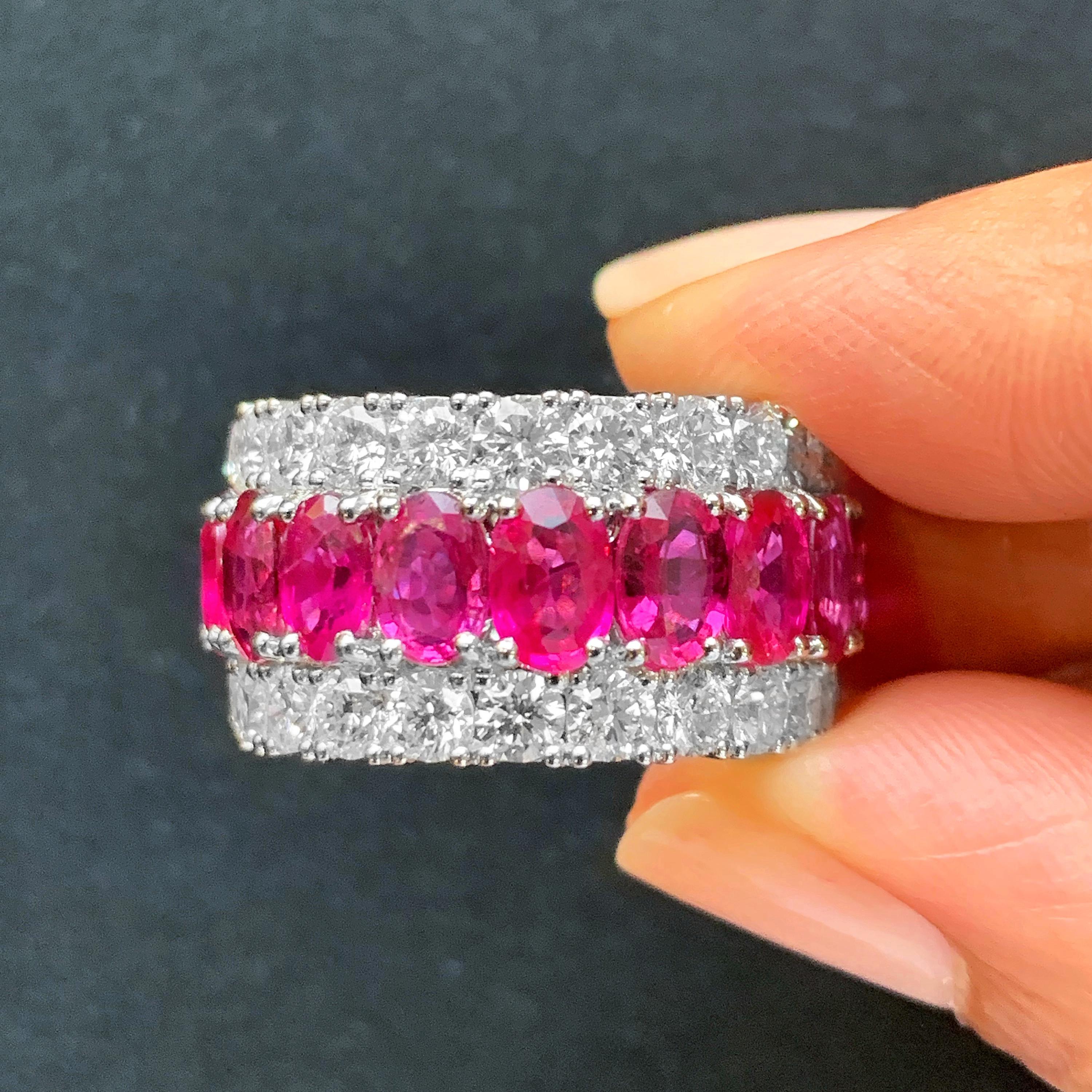 Butani's stunning diamond eternity band ring features a center row of oval red rubies (totaling 11.0 carats) and two rows of brilliant-cut round diamonds (totaling 5.02carats).  Set in 18K white gold.  A classic and timeless piece.  Currently a ring