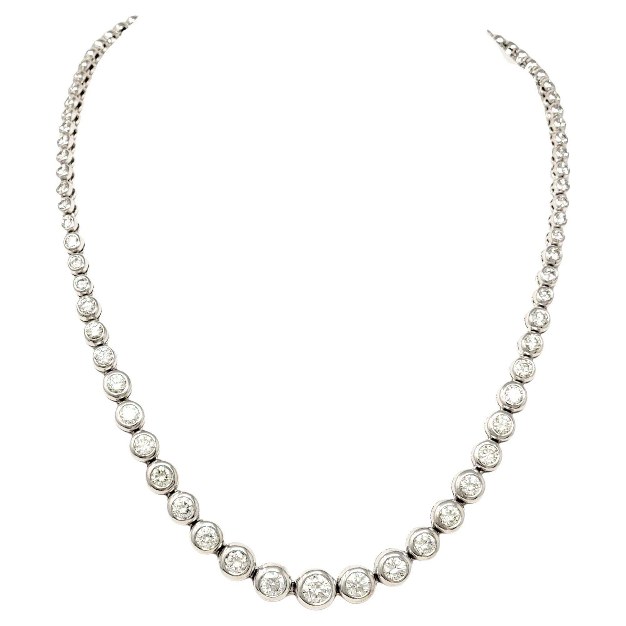 This showstopper 16.05 carat diamond necklace will absolutely take your breath away. This strikingly sparkly piece features 83 icy white natural round diamonds bezel set in polished white gold and set in a single graduated row, offering a clear,