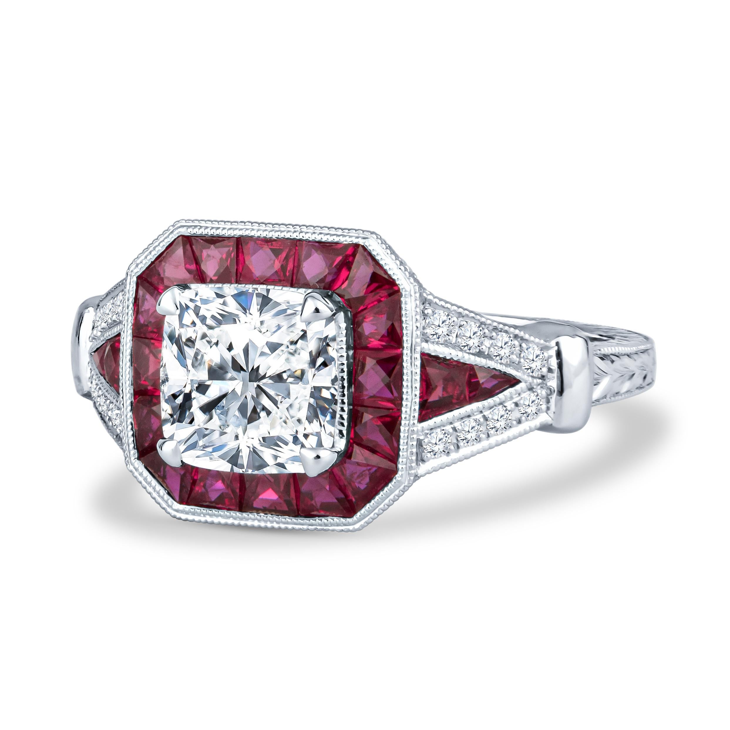 This Shaftel Diamonds engagement ring is part of one of our unique collections of engagement rings. This particular ring features a beautiful 1.60ct cushion cut diamond, J VS2, set in an 18kt white gold ring. Surrounding this ring is a 1.23ct ruby