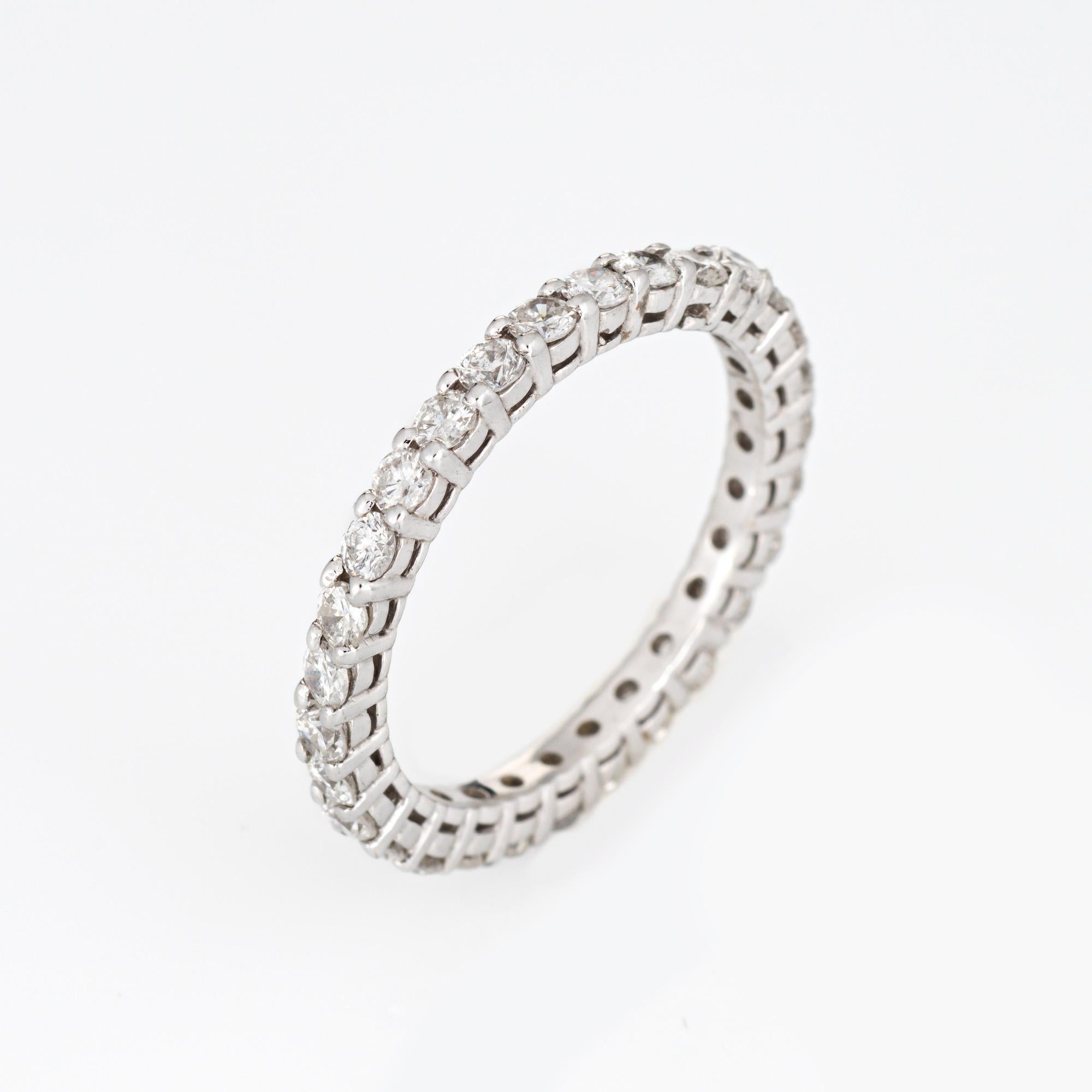 Stylish vintage diamond eternity ring crafted in 14 karat white gold. 

Round brilliant cut diamonds total an estimated 1.60 carats (estimated at H-I color and SI1-I1 clarity).  

The simple and elegant band is great worn alone or stacked. The ring