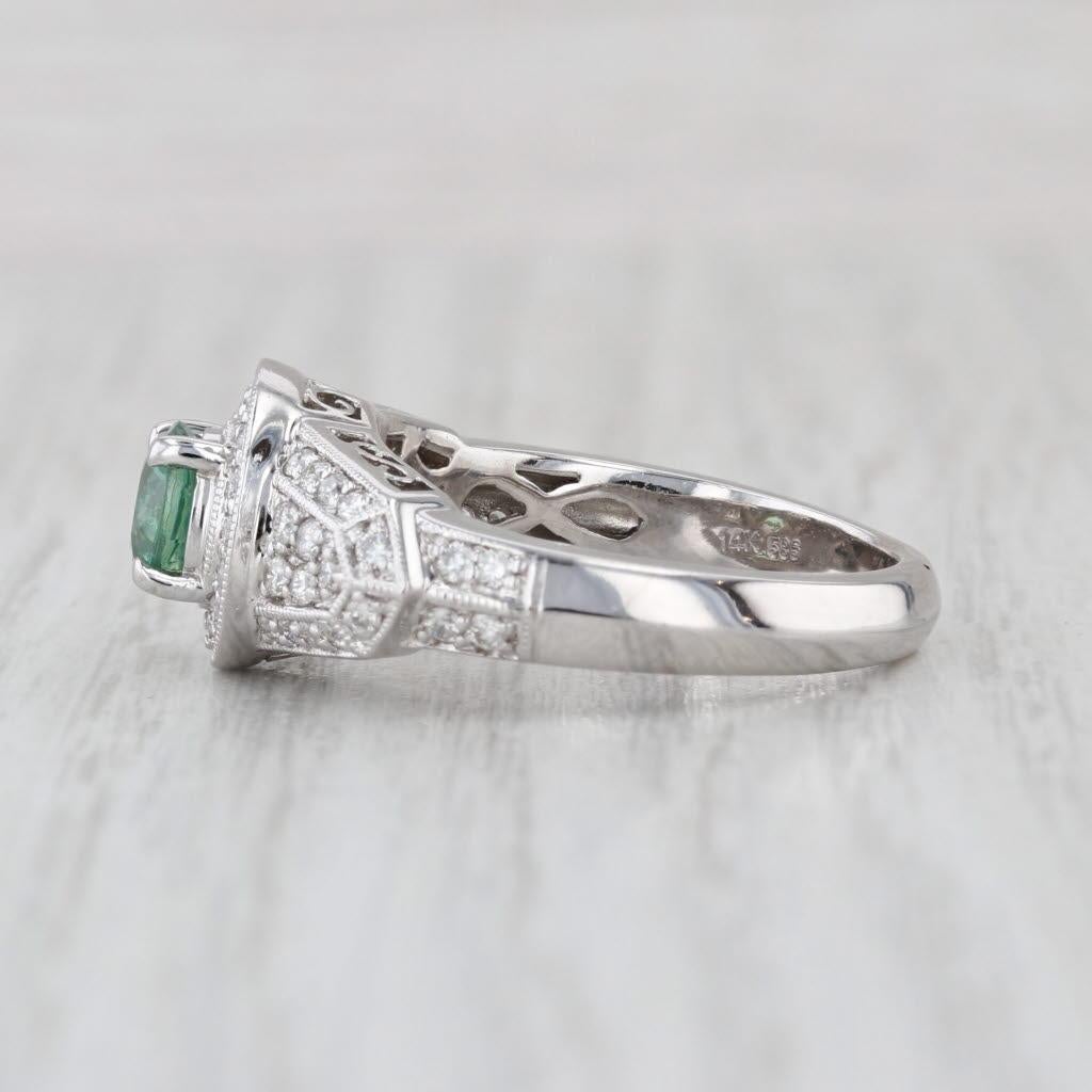 Información sobre la gema:
- Circón natural -
Quilates - 1.10ct
Talla - Redonda brillante
Color - Verde

- Diamantes naturales -
Quilates Totales - 0.50ctw
Talla - Redonda brillante
Color - F - H
Claridad - SI2 - I1

Metal: Oro blanco de 14