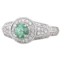 Anello con diamante aureolato con zircone verde da 1,60 ct. in oro bianco 14 carati, misura 8 di fidanzamento