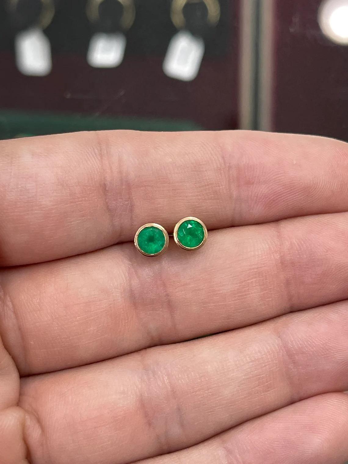 1.60tcw 14k emerald earrings...