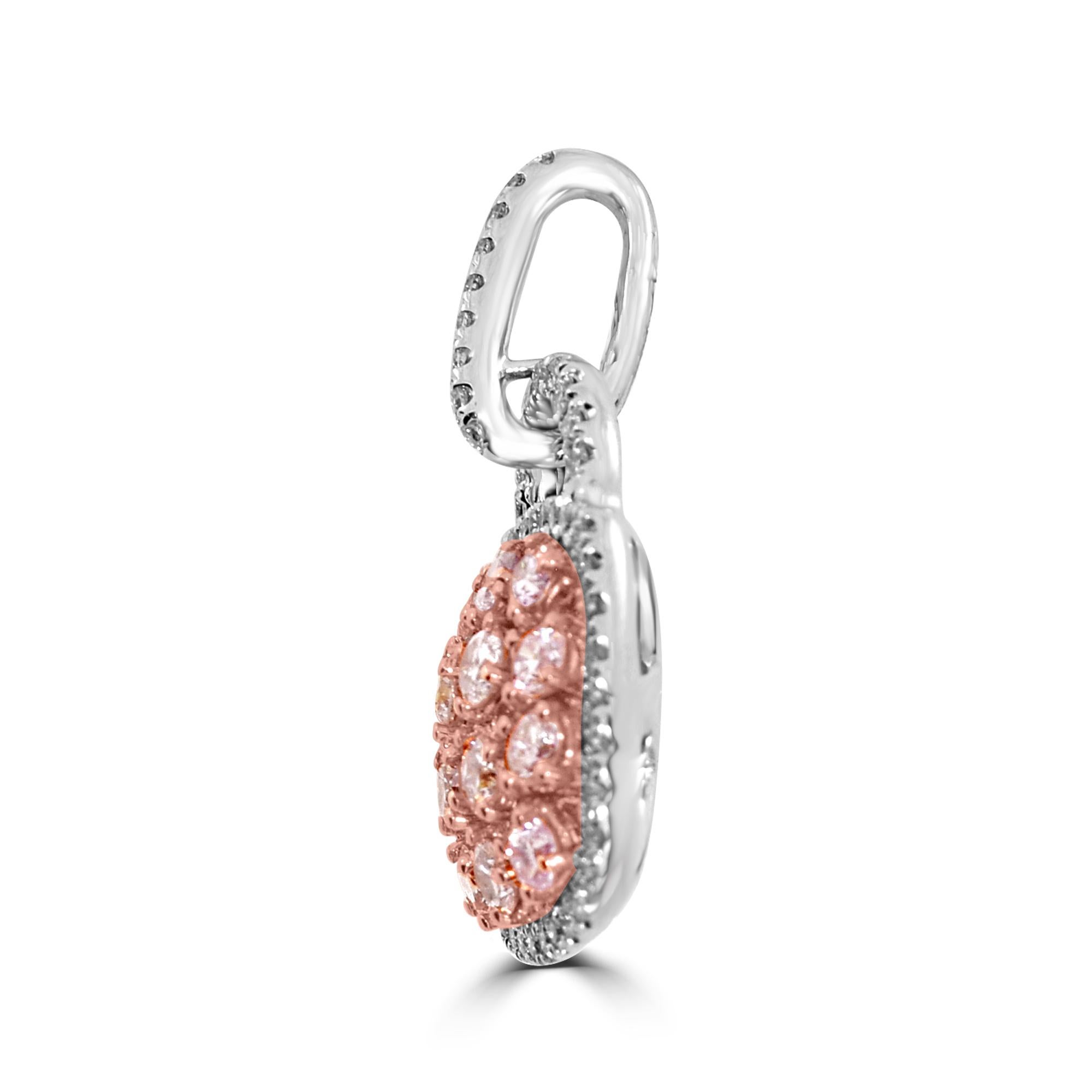 Dainty and Stylish Natural Fancy Pink Diamond Purse Pendant 
Total Carat Weight: 1.30 Carat
Natural Fancy Pink Diamonds: 0.92 Carats (total 14 stones)   
White Diamonds: 0.38 Carats (total 50 stones)
Setting 4.30 grams, 18k Rose, and White Gold