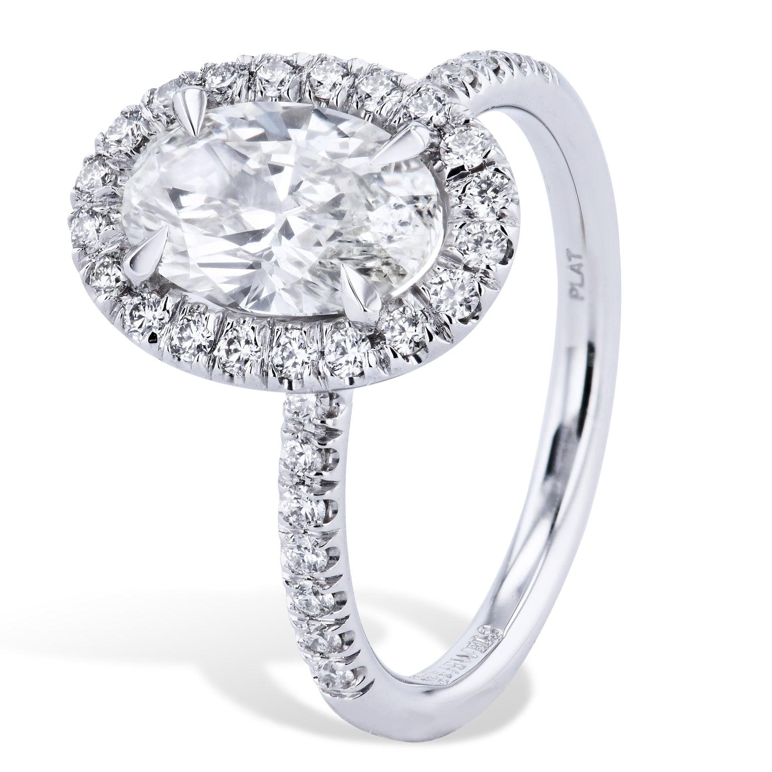 This oval diamond ring is absolutely stunning! It boasts 1.61 carats. It is GIA certified and is K in color with a clarity of SI1. 
It is a handmade ring and one of a kind. It is made in house and no attention to detail has been spared. 
There are