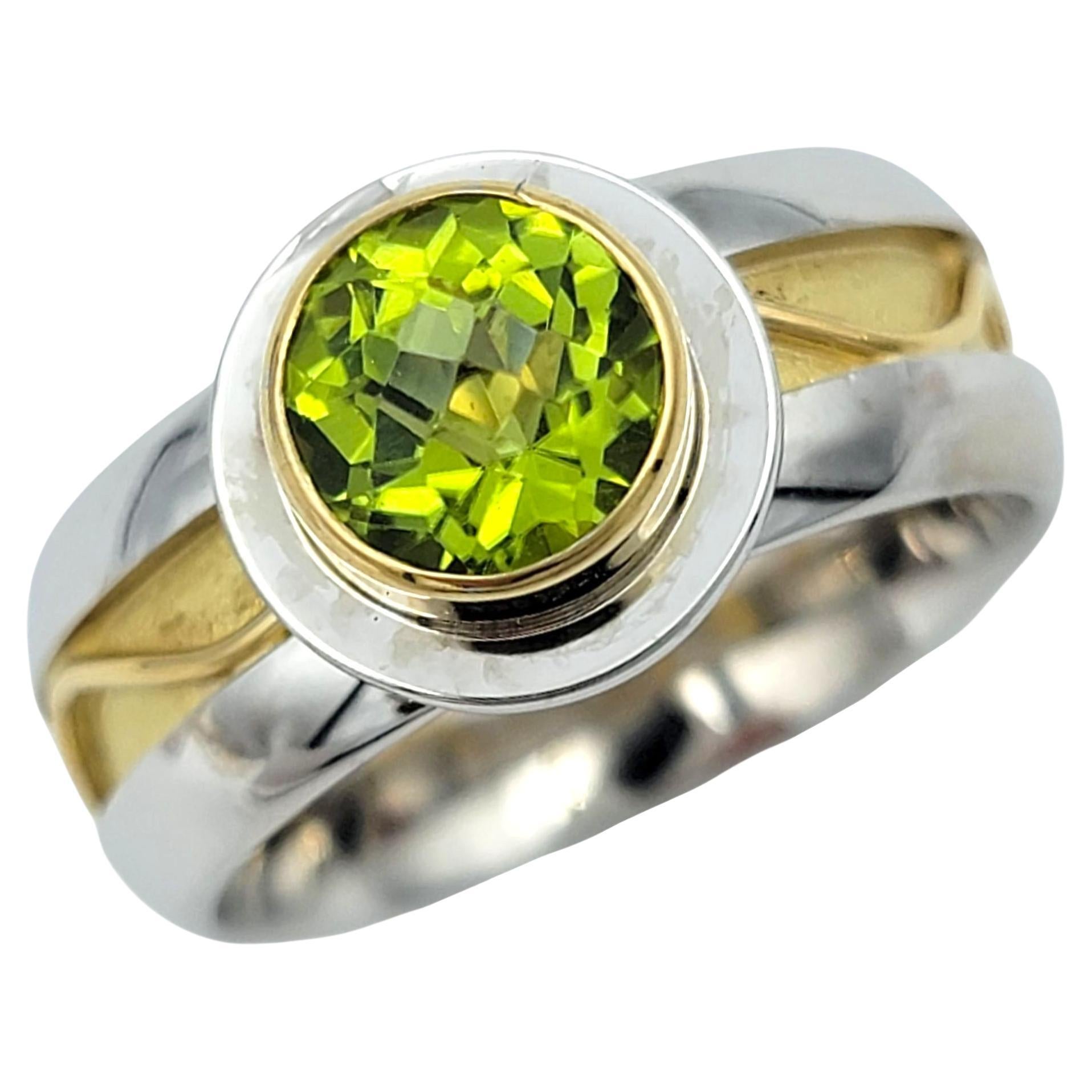 This striking ring features a vivid round-cut peridot, glowing with a lush green hue that instantly draws the eye. The gemstone’s vibrant brilliance is beautifully highlighted by its clean cut, offering a fresh and radiant sparkle that captures the