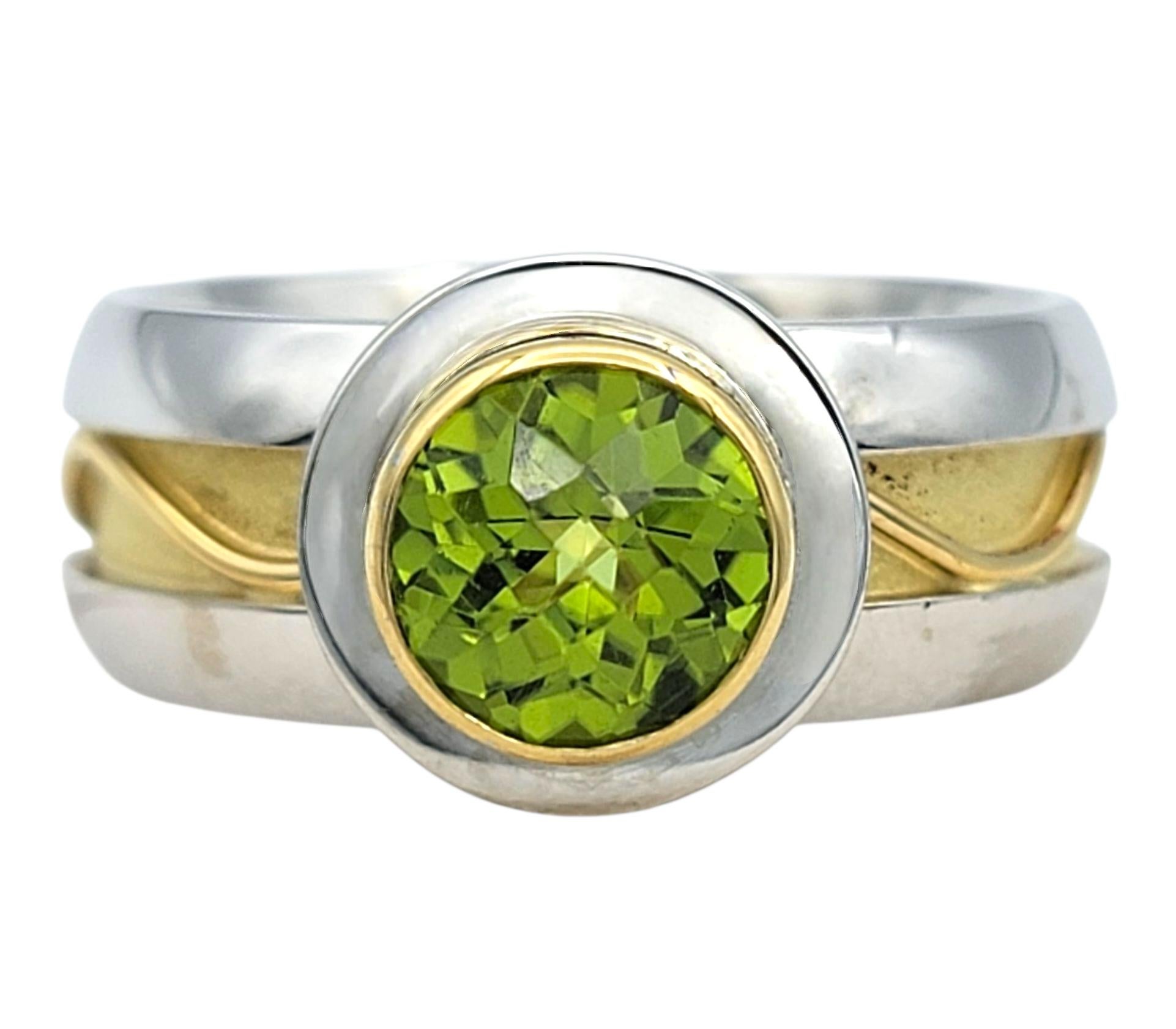 Contemporary 1.61 Carat Round Cut Bezel Set Peridot Solitaire Ring in Two-Tone 18 Karat Gold For Sale