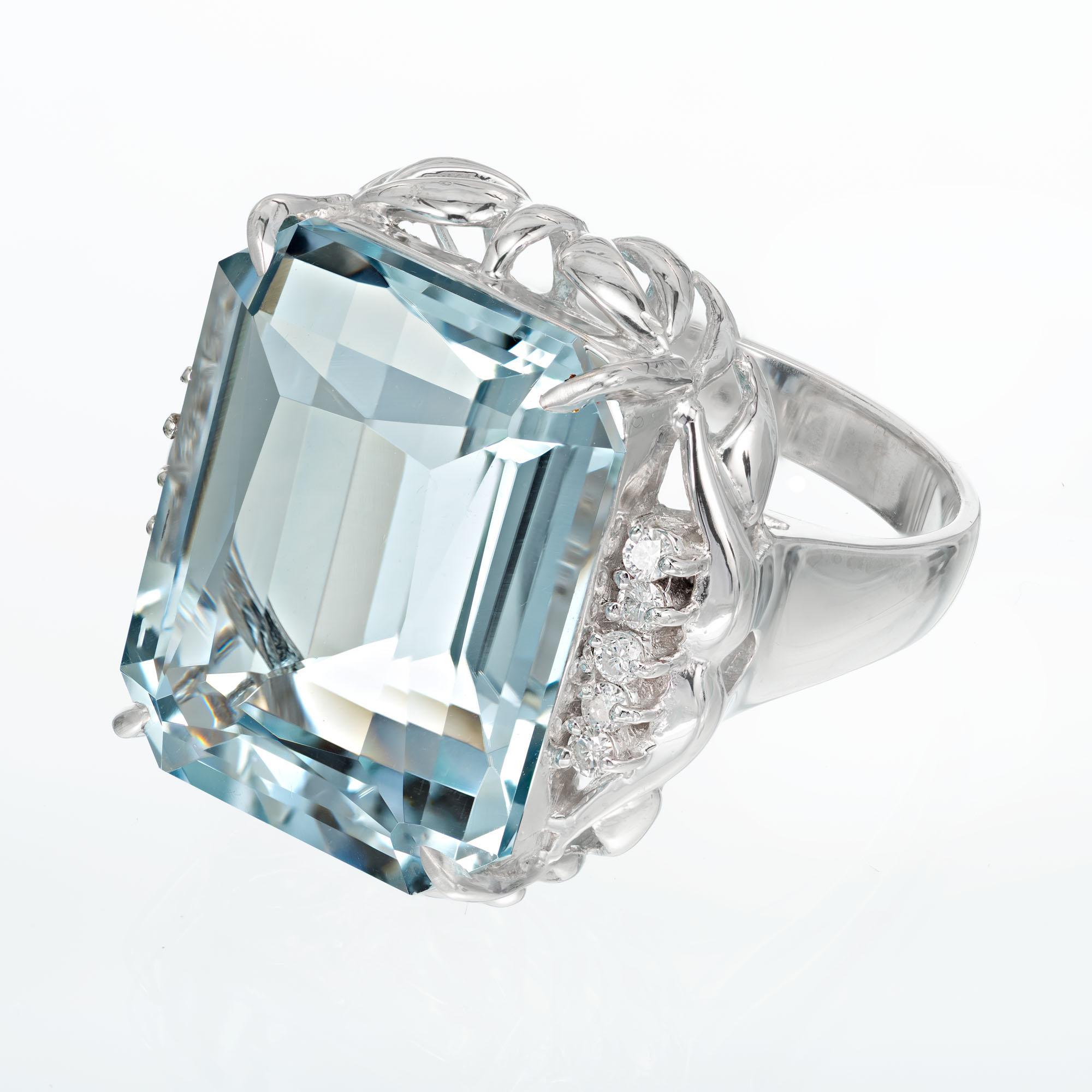 Emerald and diamond cocktail ring. 16.11 carat natural aquamarine in its original platinum 1950's setting with round accent diamonds. 

1 cut cornered emerald cut light blue aquamarine VVS, approx. 16.11cts
10 round brilliant cut diamonds H SI,