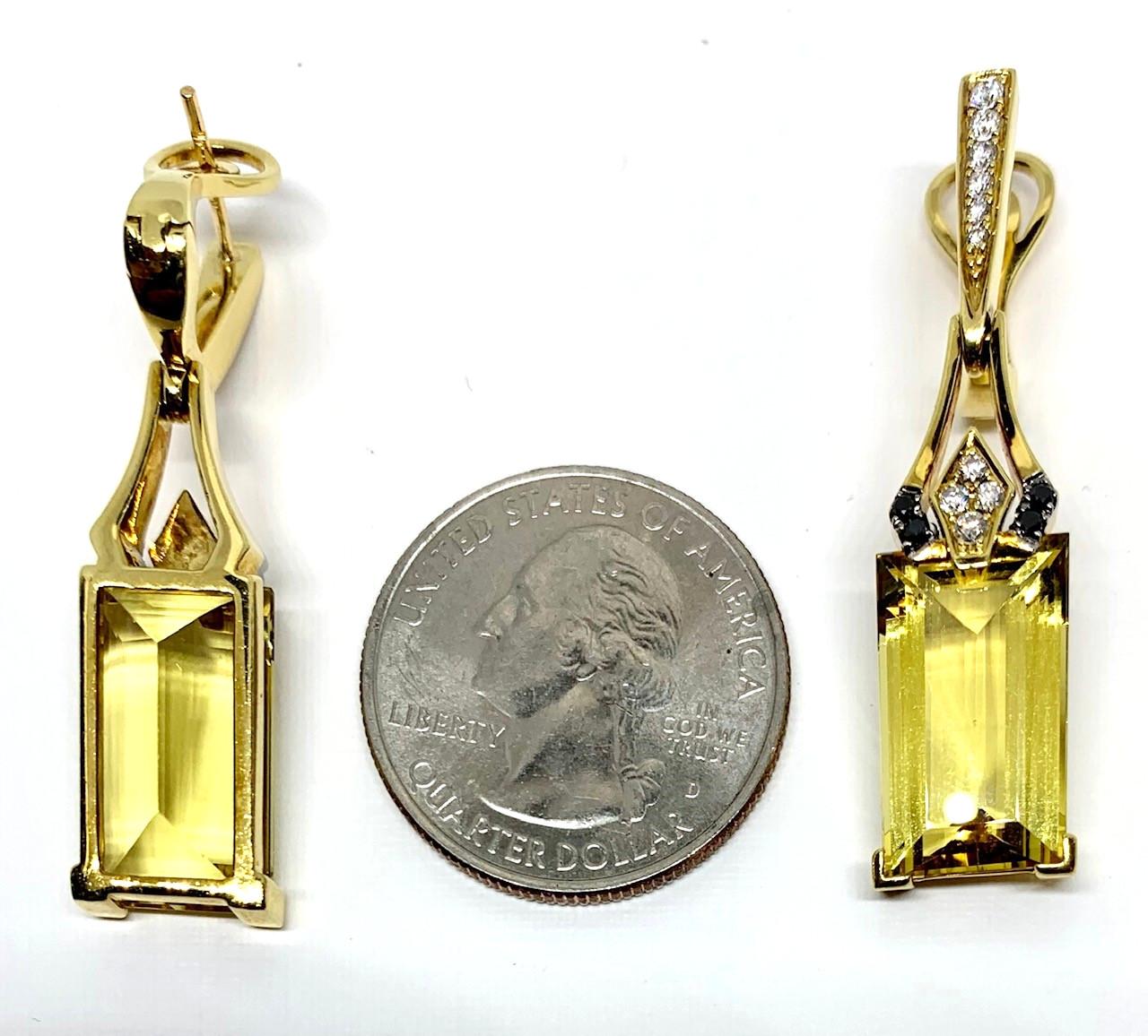 These beautiful 18k yellow gold handcrafted earrings feature clear, bright, rectangular cut yellow beryl and dramatic black diamonds. Yellow beryl belongs to the same mineral family as aquamarine, emerald, and morganite! Accented with a striking