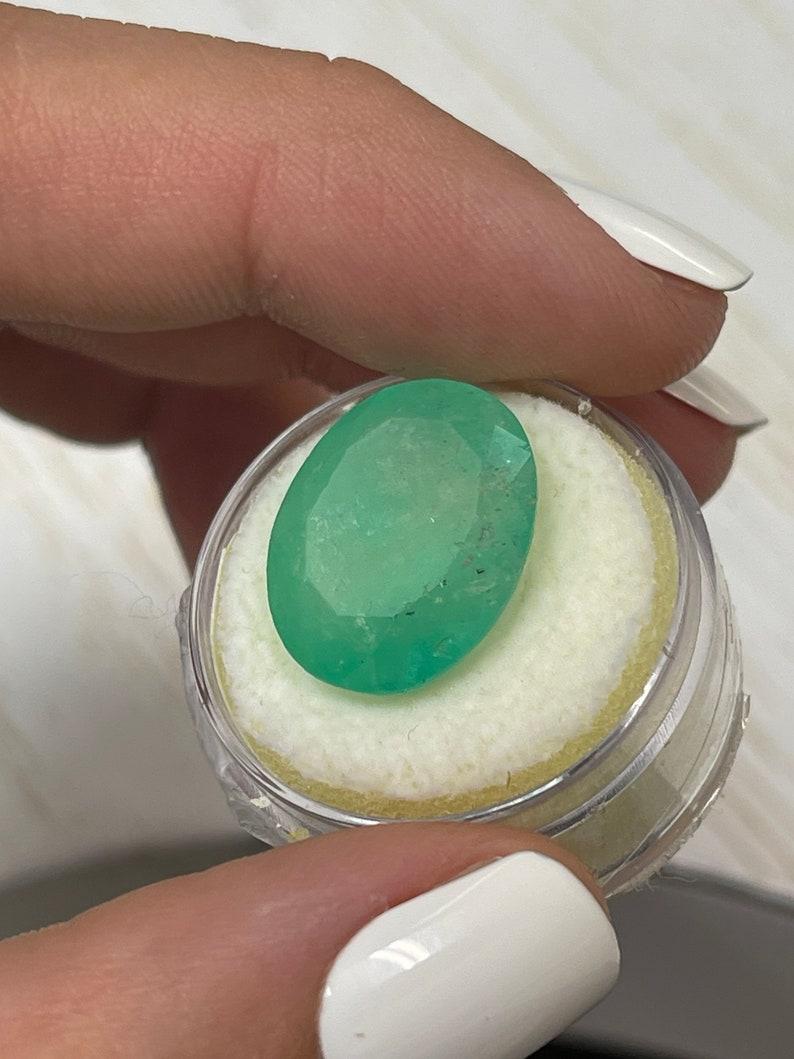 16.15 Carat Earthy Green Colombian Emerald Oval Cut - May Birthstone Gem In New Condition For Sale In Jupiter, FL