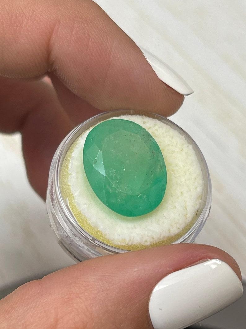 Women's or Men's 16.15 Carat Earthy Green Colombian Emerald Oval Cut - May Birthstone Gem For Sale