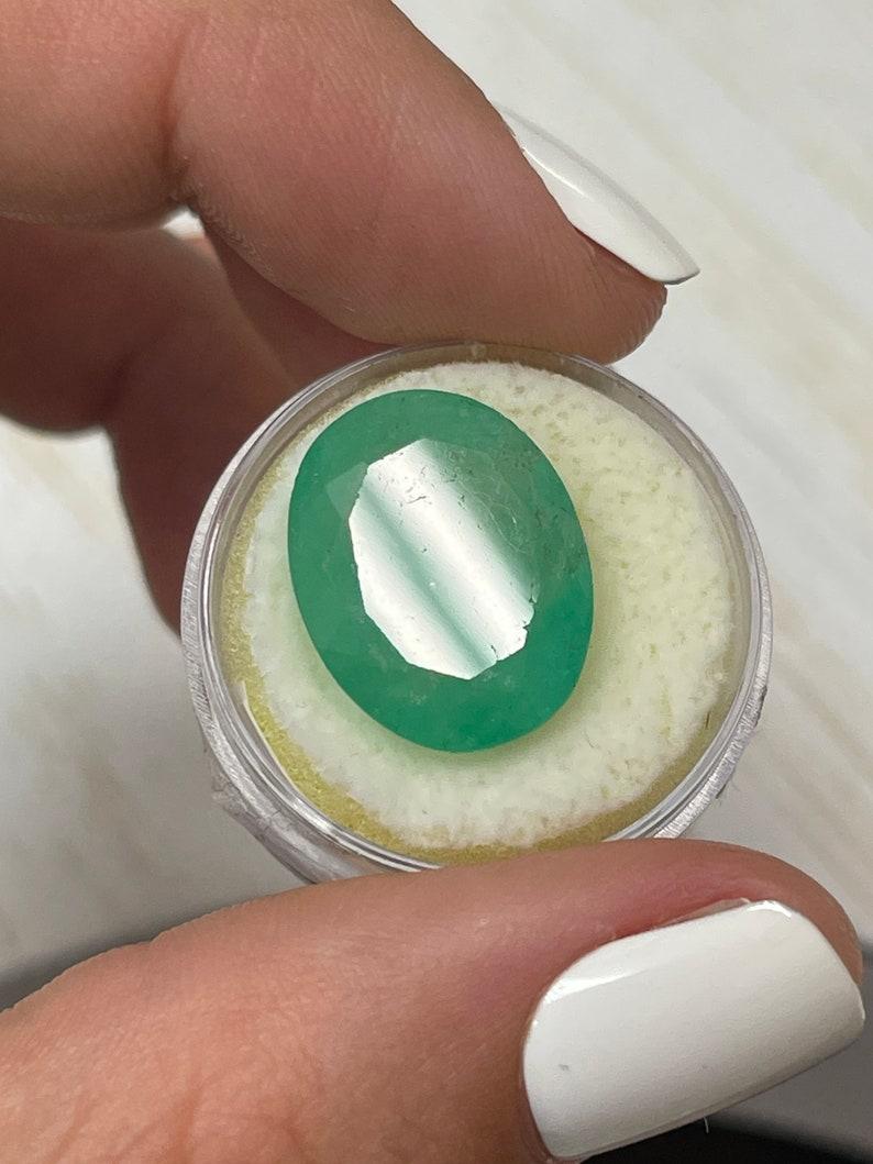 16.15 Carat Earthy Green Colombian Emerald Oval Cut - May Birthstone Gem For Sale 1
