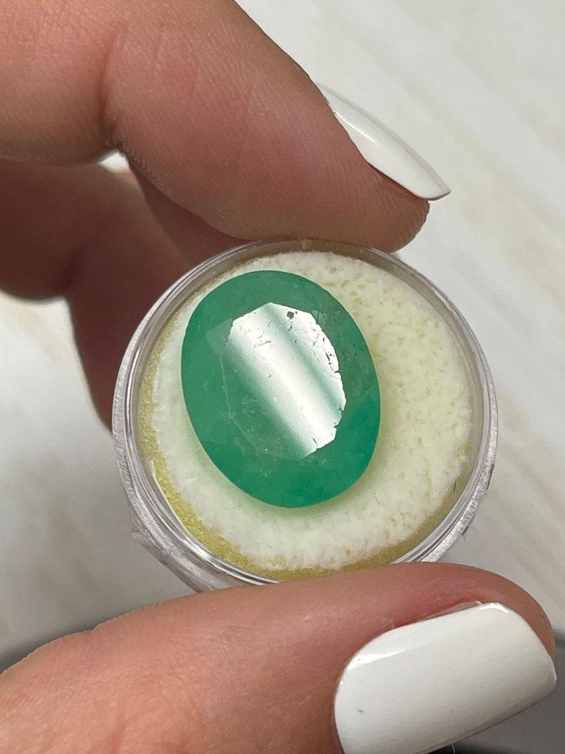 16.15 Carat Earthy Green Colombian Emerald Oval Cut - May Birthstone Gem For Sale 2