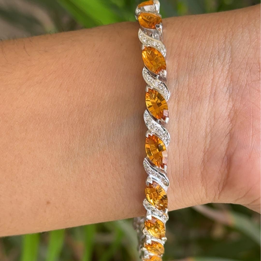 16.15 Ct Creative Style Citrine Tennis Bracelet in sterling silver showcases endlessly sparkling natural citrine, weighing 16.15 carat. It measures 7 inches long in length.
Natural Citrine stimulate concentration and reduces stress.
Designed with