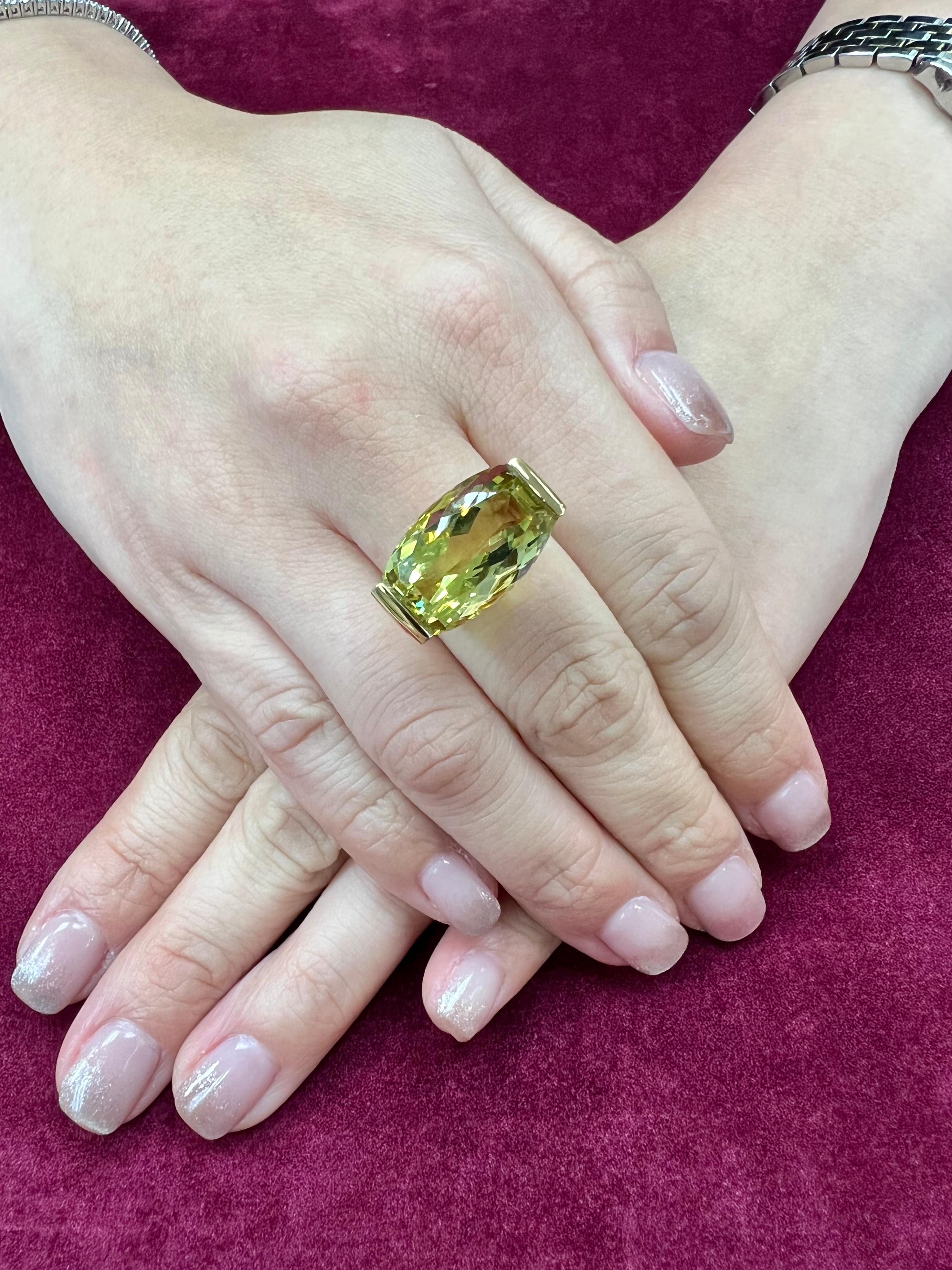 Please check out the HD video! This is a large and beautiful contemporary cocktail ring. The 16.16 Cts  checker cut lemon quartz is set horizontally. The lemon color is strong and full of life. The 18k solid yellow gold setting is very eye catching
