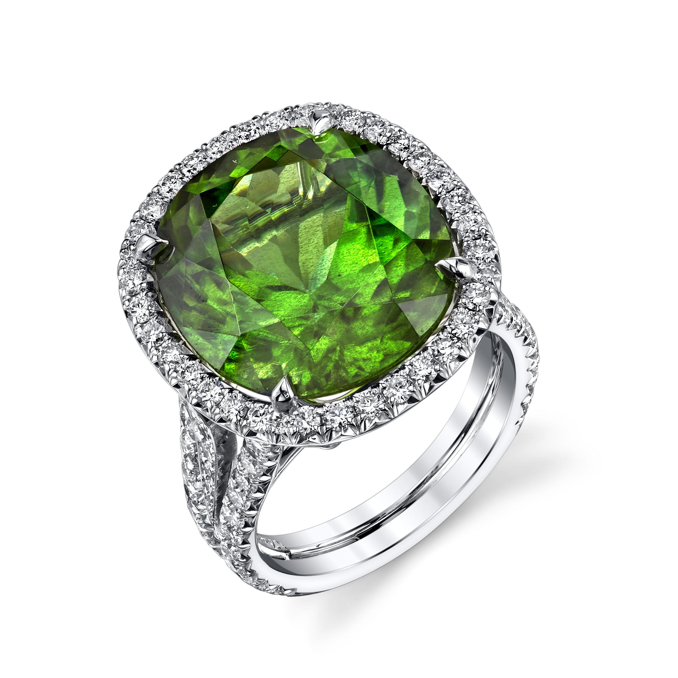 16.16ct. Burmese Oval Peridot Ring, accented with 1.15ct. of diamonds around the center stone. This design is set in 18 karat white gold.
Peridot is considered to be the birthstone for August and is the stone traditionally given in celebration of