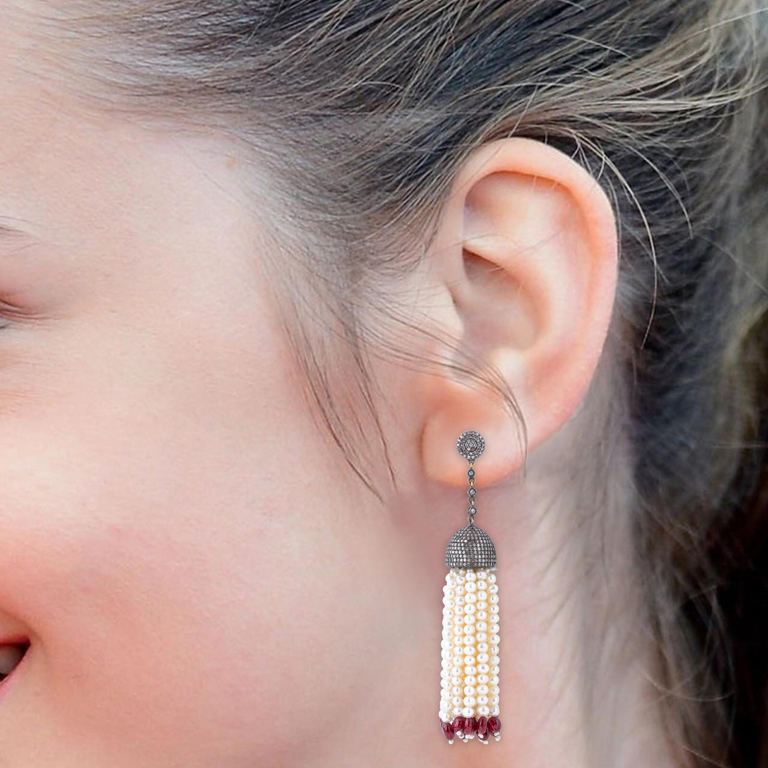 Immerse yourself in opulence with our 161.7 Carat Diamond, Pearl, and Ruby Dangle Earrings. Each uniquely crafted and curated pair exudes a blend of classic elegance and contemporary sophistication, offering a timeless addition to any jewelry